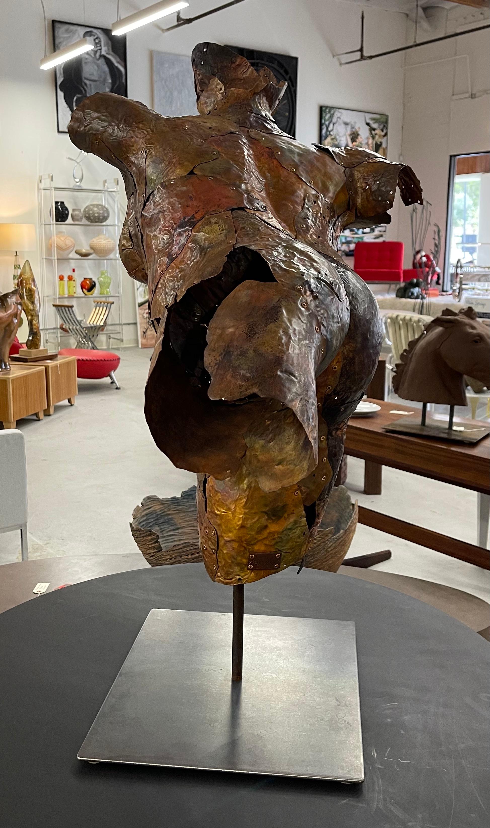 Stunning copper sculpture by the noted Central Coast artist Michael Hannon. Graceful and moving the sculpture is titled “Athena” and bears a plaque with the artist’s name. The sculpture is mounted on a iron base and rotates. Please be sure and have