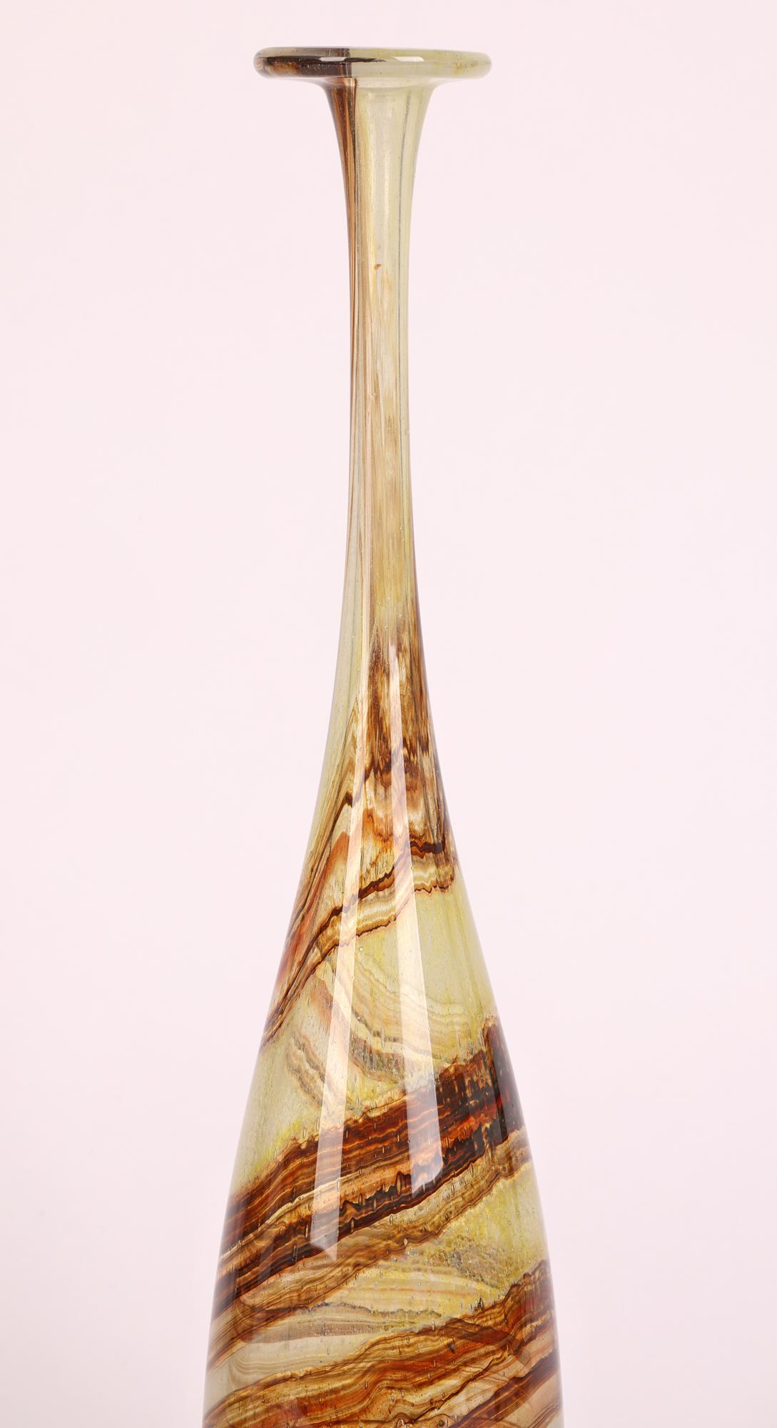 A tall and stylish vintage art glass bottle vase made by Michael Harris (British, 1933-1994) at the Isle of Wight Glass Works in the early 1970’s.

Michael Harris was a renowned glass maker and studied glass design at Stourbridge College of Art