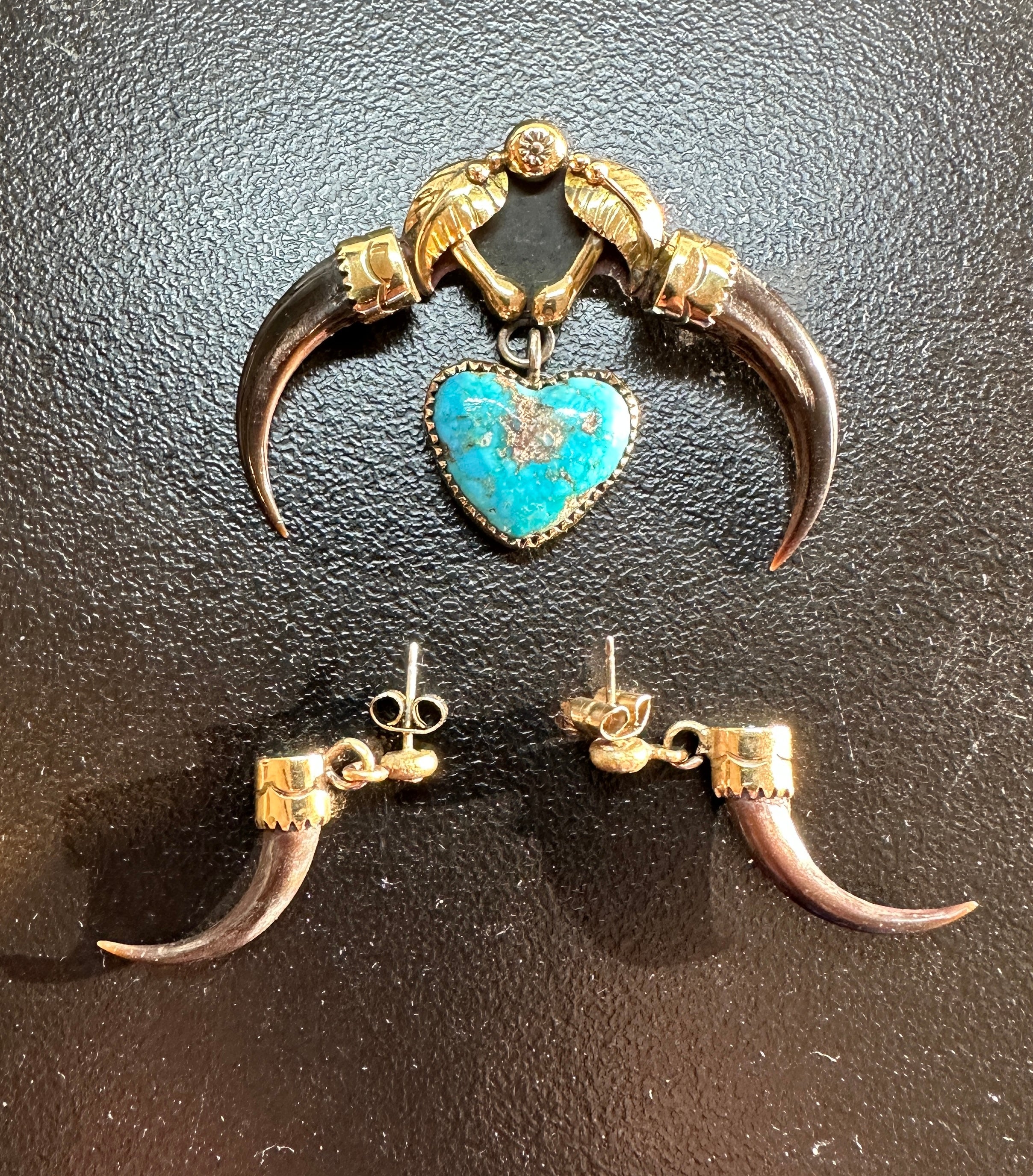 THIS IS A MAGNIFICENT AND RARE PENDANT NECKLACE WITH MATCHING EARRINGS BY THE RENOWNED YAQUI NATIVE AMERICAN INDIAN ARTIST MICHAEL HORSE.   THE RARE JEWELS ARE 14 KARAT YELLOW GOLD WITH A STUNNING TURQUOISE HEART SHAPED GEM IN THE CENTER.
The jewels