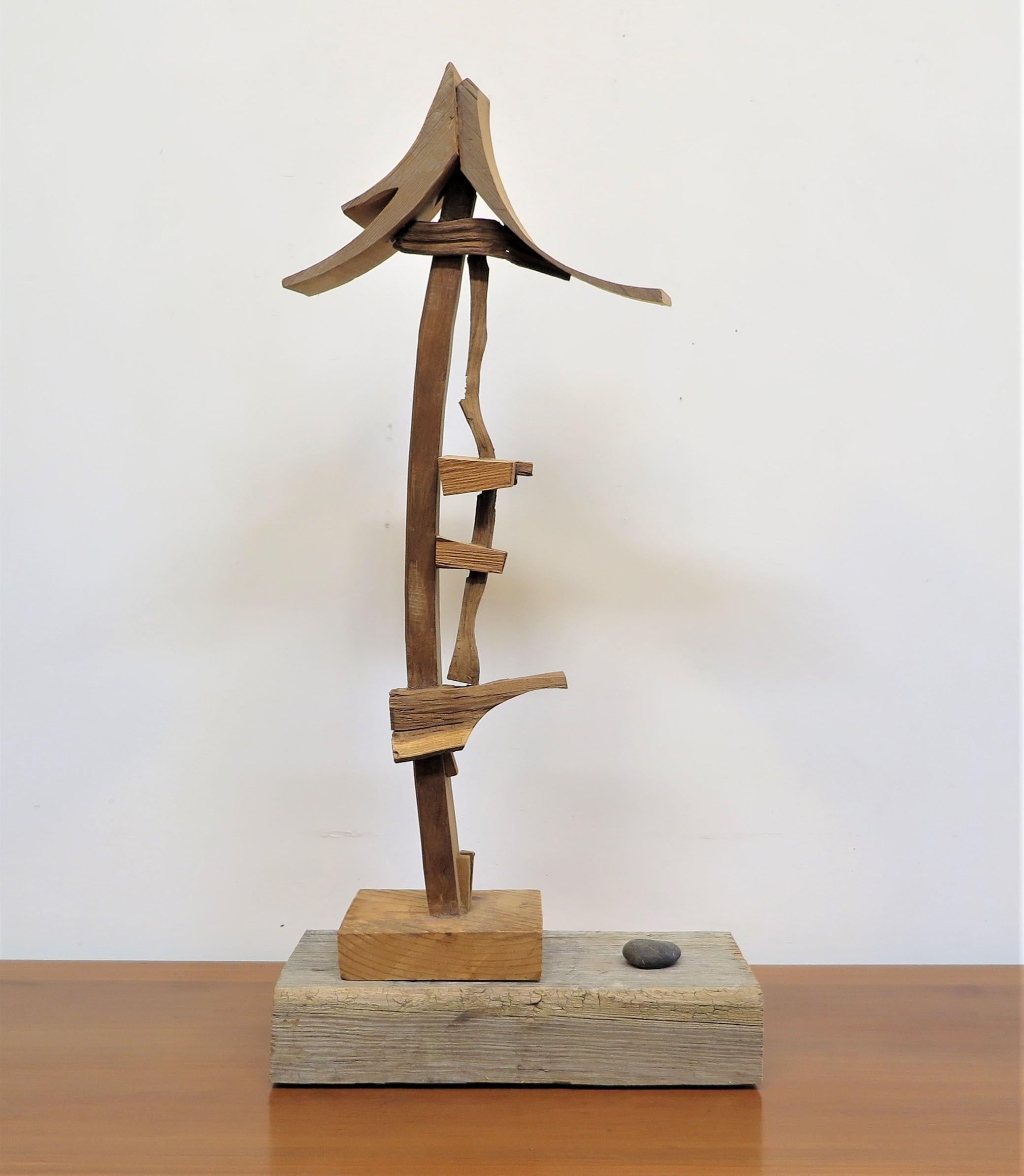 Abstract wooden sculpture by Artist Michael Ince born 1942. An early work 1970's of assembled cut crafted wooden pieces in his signature format. The delicate nature of his precise arrangement into composition is serene, peaceful, and compelling with