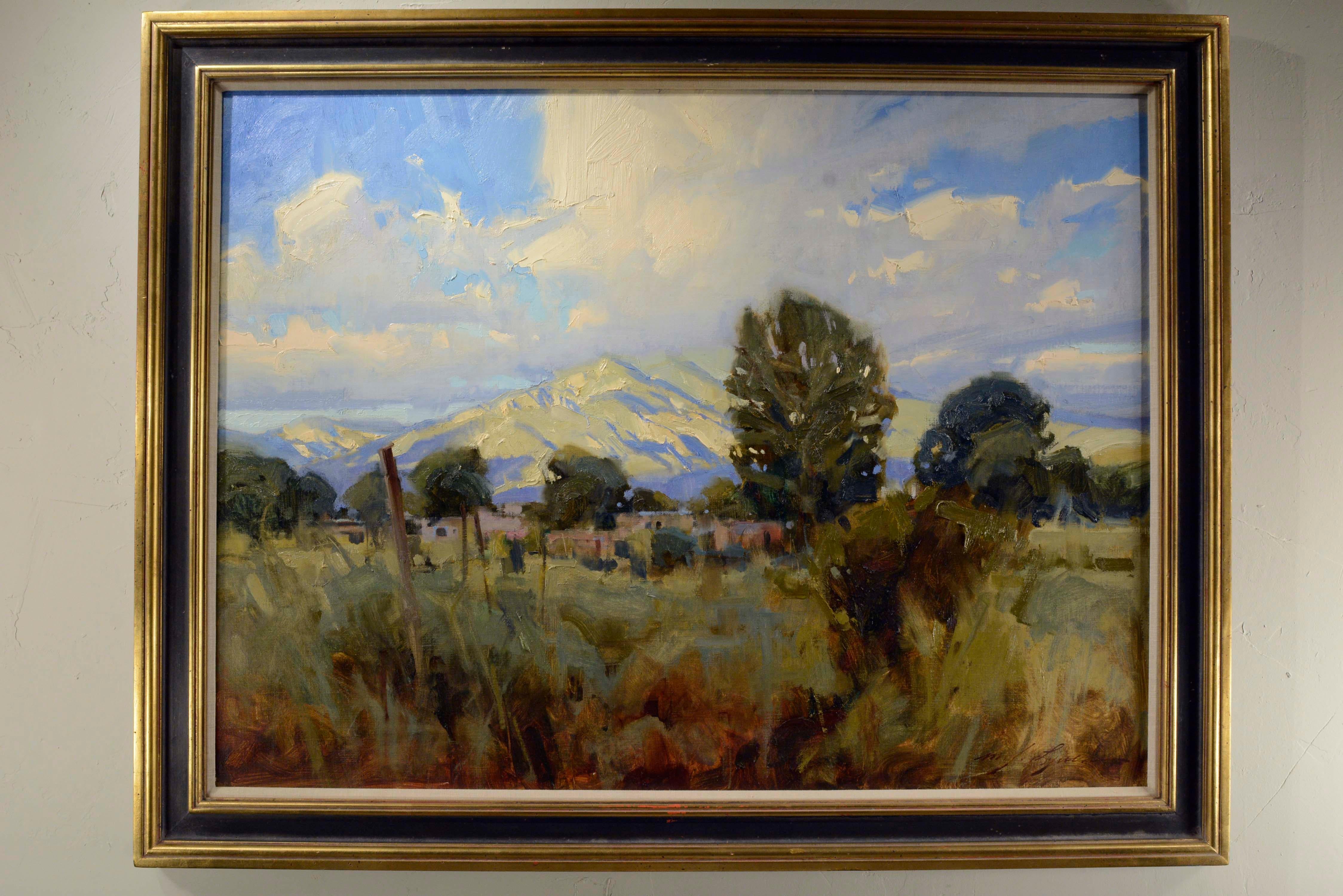 Michael J. Lynch b.1950.  Born and raised in Denver, CO.  Noted for his western landscape paintings of Colorado, California, New Mexico, etc.  

This lovely work, dated 1989, show the Taos Pueblo with Taos Mountain, New Mexico, in the background. 