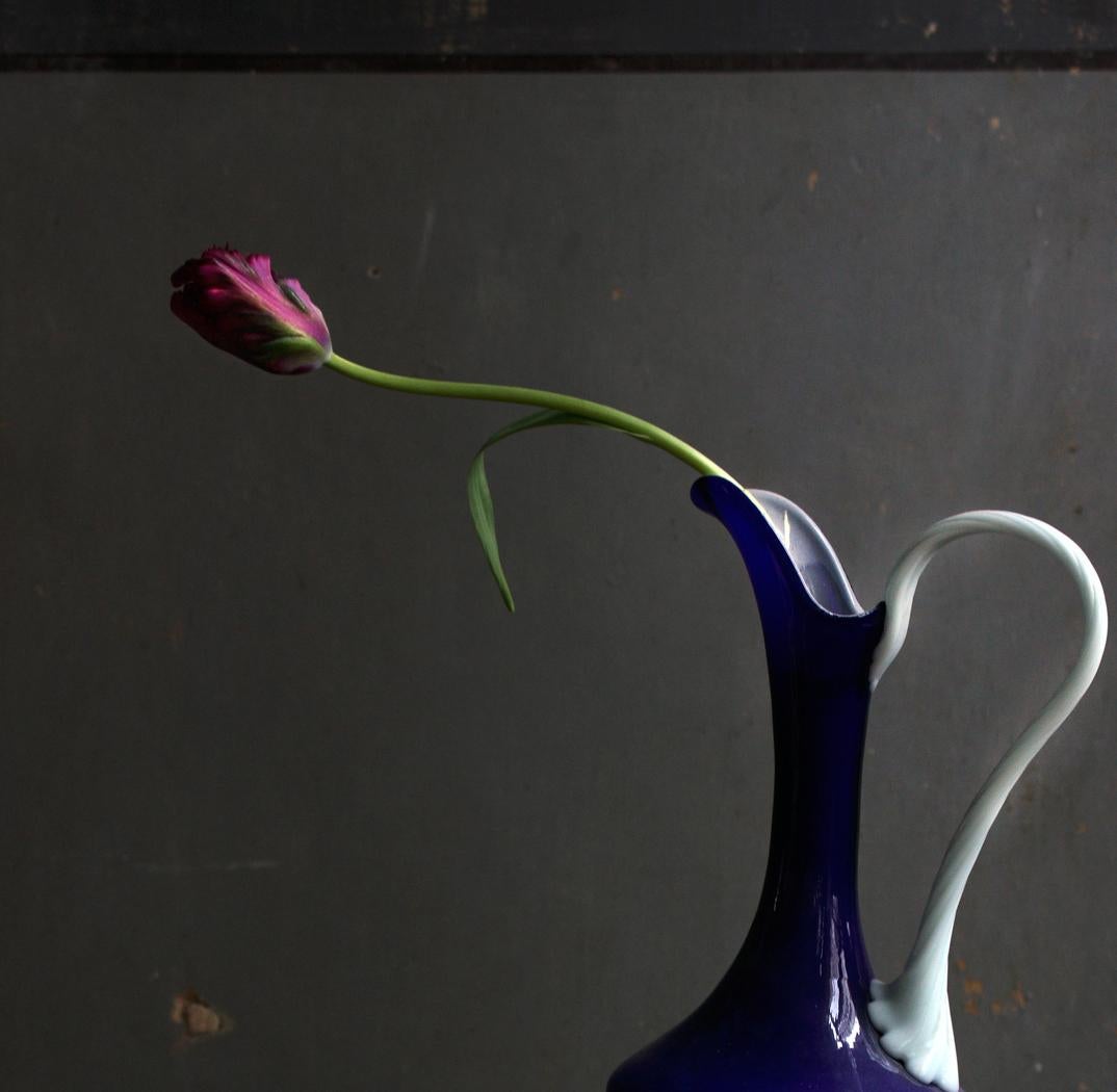 Still life with Books and a Dark Blue Opalina Vase, Antwerp. Color photograph - Photograph by Michael James O’Brien
