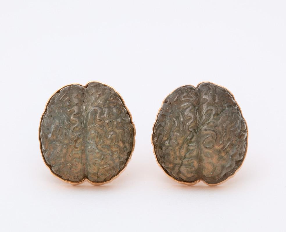 Possibly the most unique cufflink design in the field of fine jewelry!
Perfectly modeled after Albert Einstein's highly unique brain, and carved from spectrolite, these cufflinks give off an inner glow.  The spring backs feature Einstein's infamous