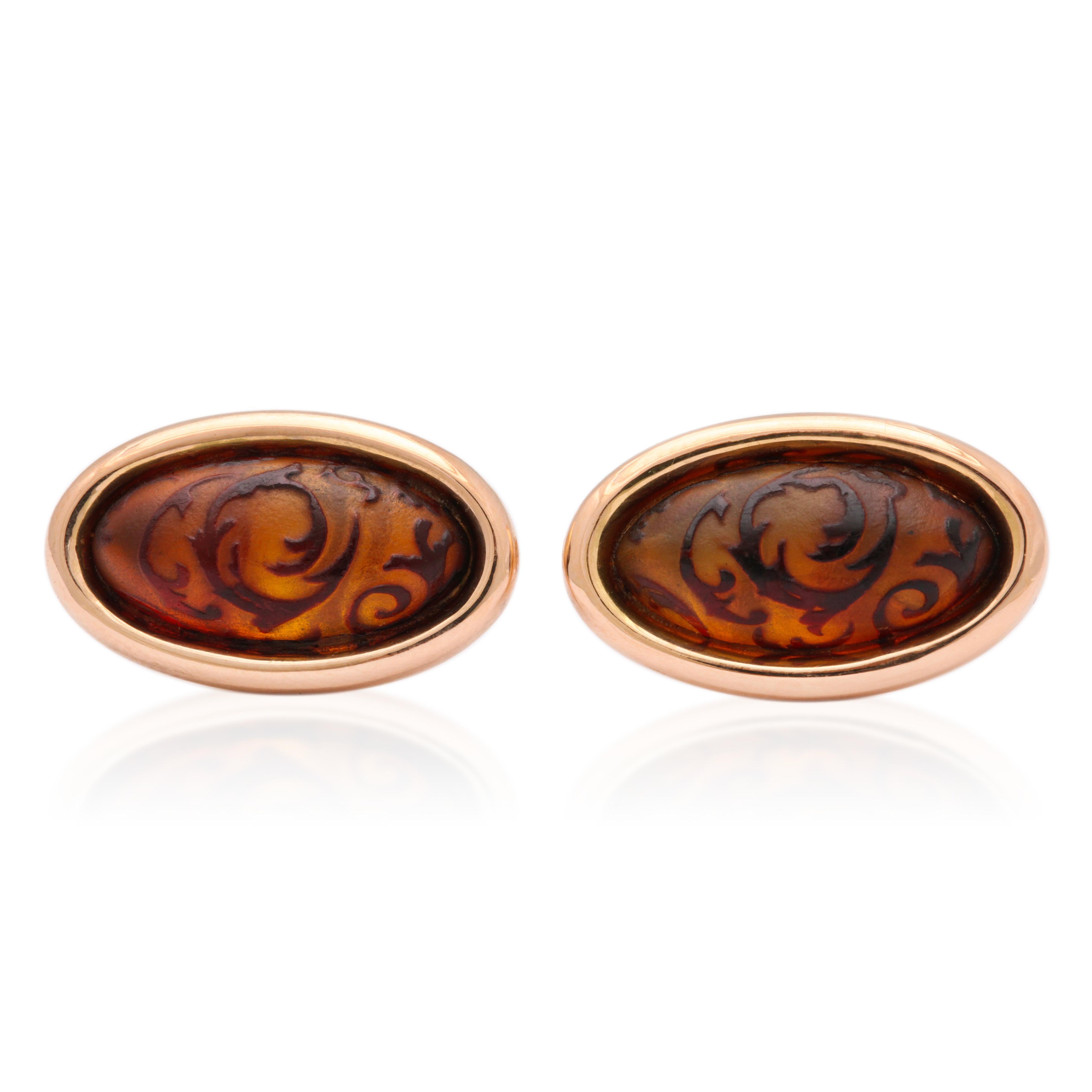 A special technique is utilized to create the design on these amber cabochons and you will never see anything else like them.  The amber is burnt to an opaque black on the surface and is then carved away to transparency, leaving the design in