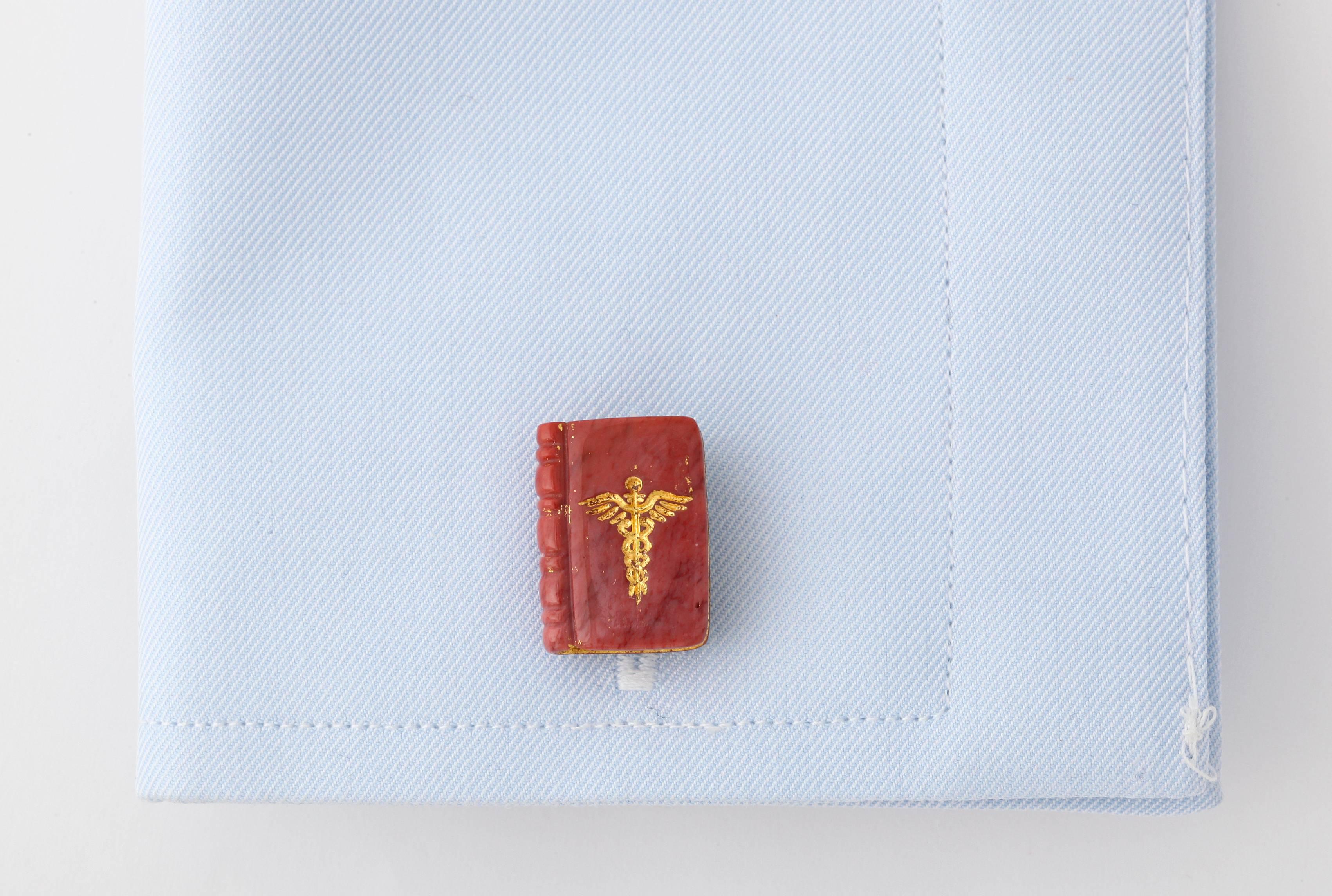 For the stylish doctor, these book cufflinks are meticulously carved from brown jasper and then inlaid with 22kt gold.  Discreet, yet highly elegant.

Designs by Michael Kanners have been described by Departures Magazine as, 
