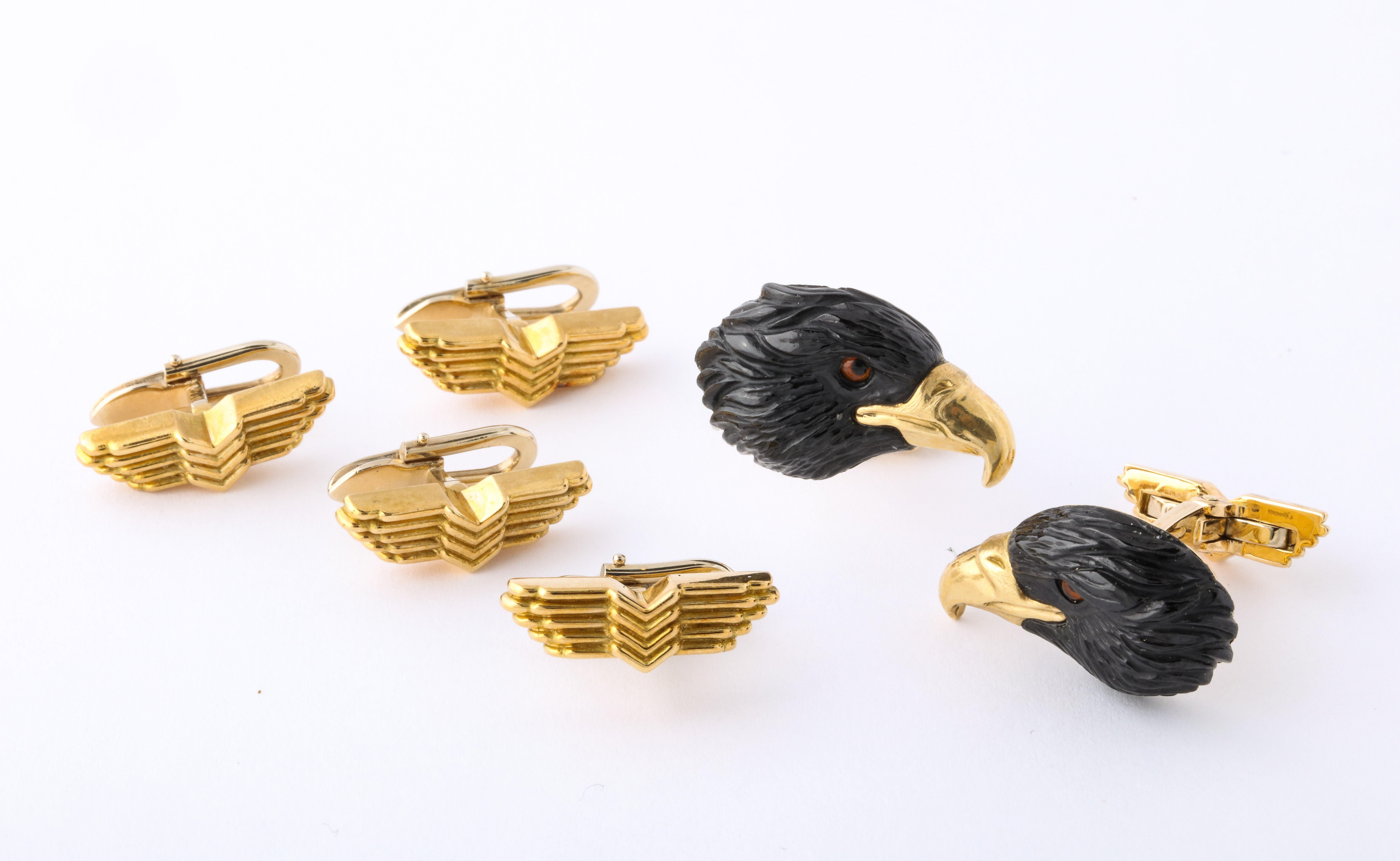 The cufflinks have been expertly carved from black tourmaline in the form of eagle heads with rock crystal and enamel eyes and 18kt yellow gold beaks.  The spring back and the matching shirt studs are a sculptural version of the eagle's wings.  This