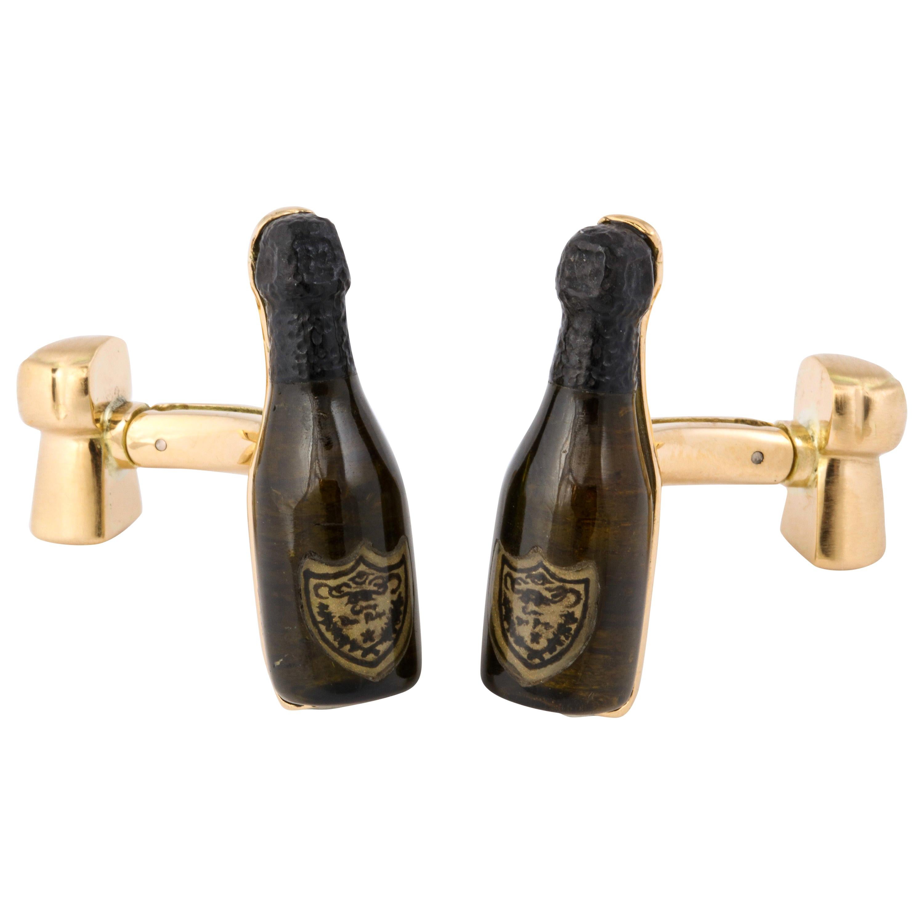 These are truly the most unique champagne bottle cufflinks around. The bottle is expertly shaped from green tourmaline by a master stone carver. The top of the bottle, traditionally covered in black foil, is carved from black tourmaline. Finally,