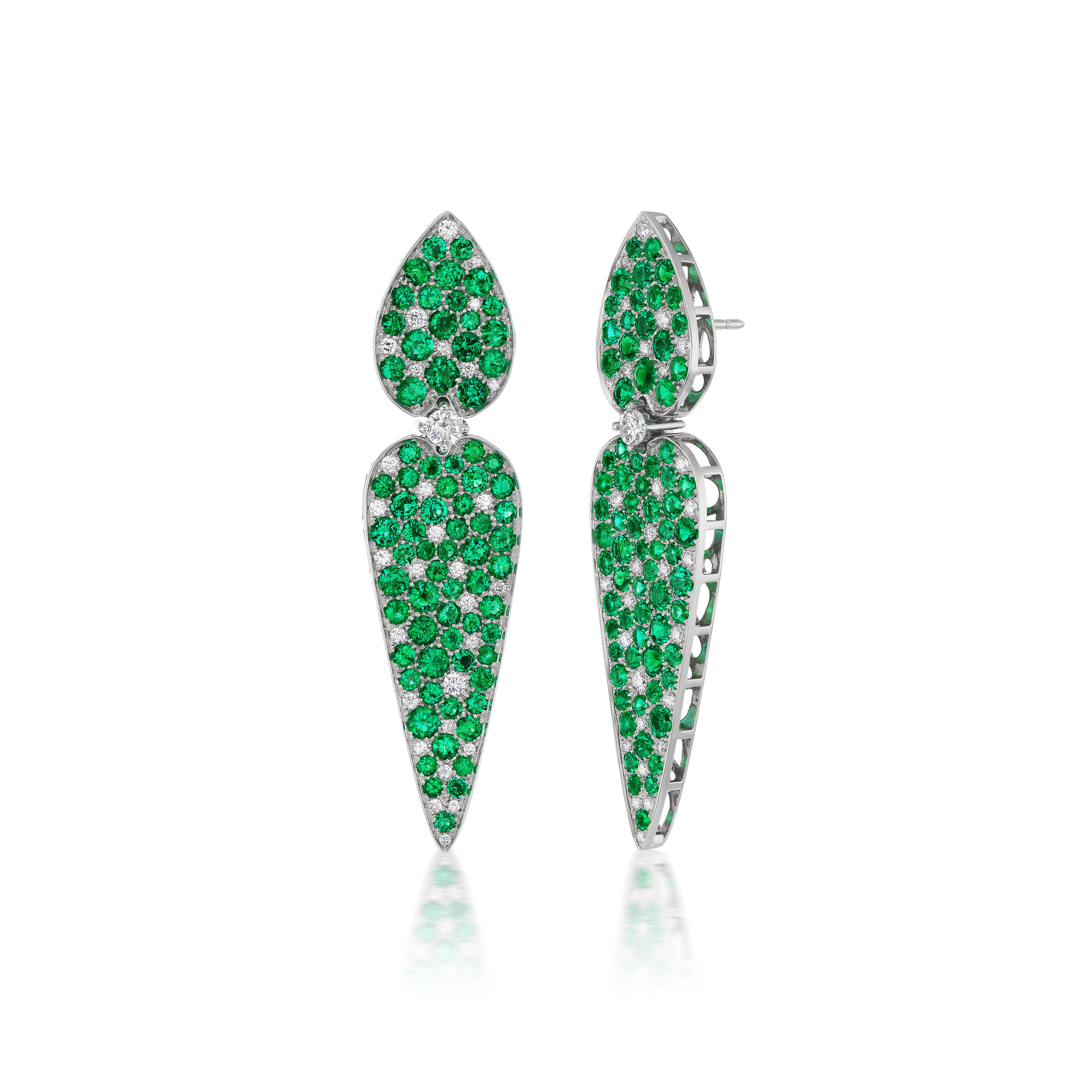 The finest Colombian emeralds are mounted in titanium and highlighted with diamonds in these striking earrings.  The emeralds speak for themselves and this gem quality nearly glows, even at night.  The mounting will make you glow, with joy, as they