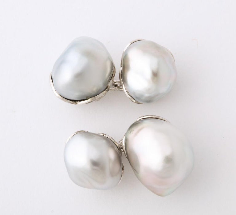 Four beautifully matched, and rare, keshi pearls comprise this elegant pair of cufflinks.  The custom made mounting was carefully crafted to perfectly adhere to the pearls, exhibiting a level of craftsmanship rarely seen today.  
Delivered in the