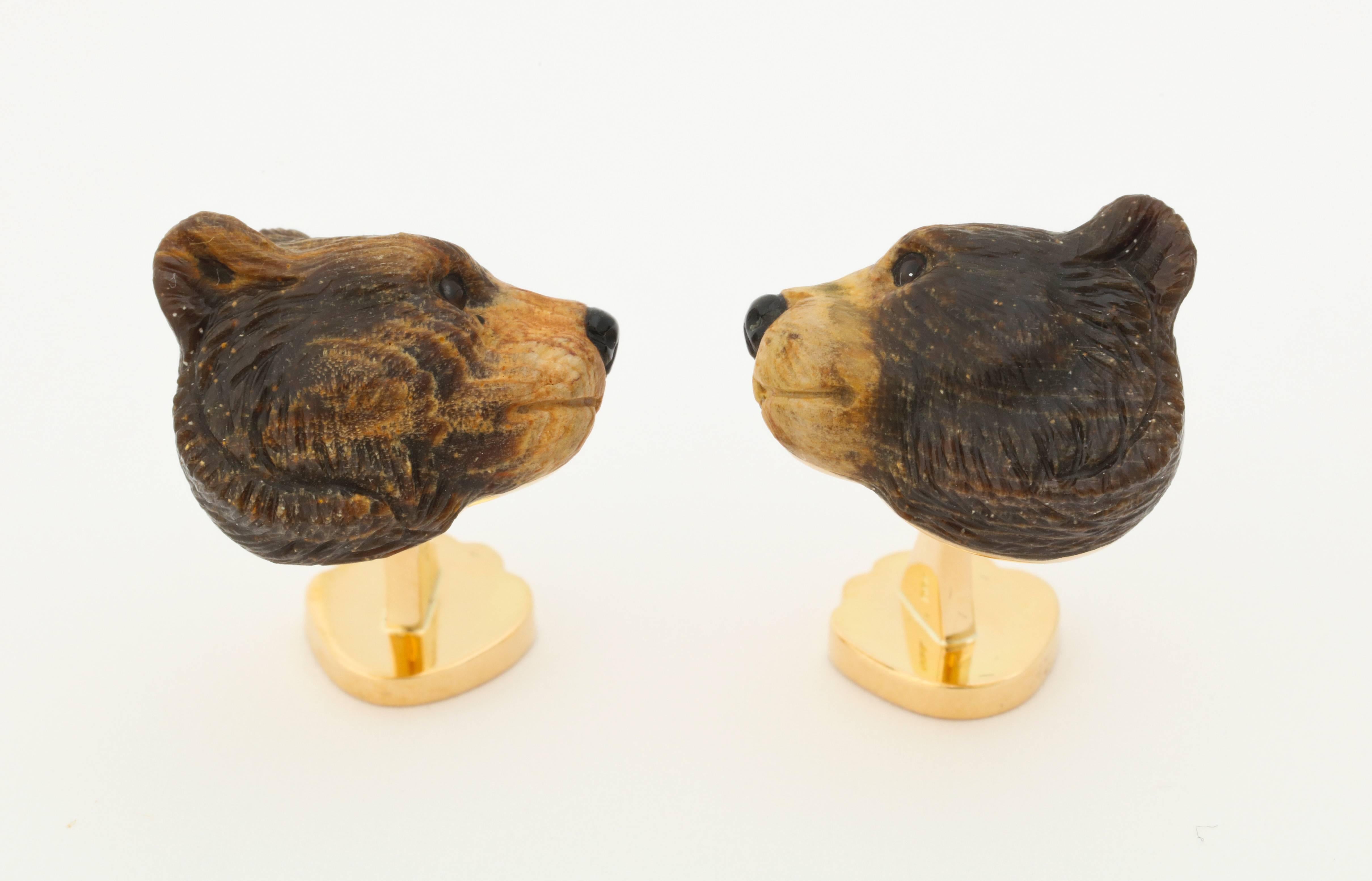 Finely carved in Germany, from fossilized wood, these bears show a level of detail rarely found today.  The single piece of wood chosen for this work was carefully positioned so that the light colored vein would be on the front of the face.  The