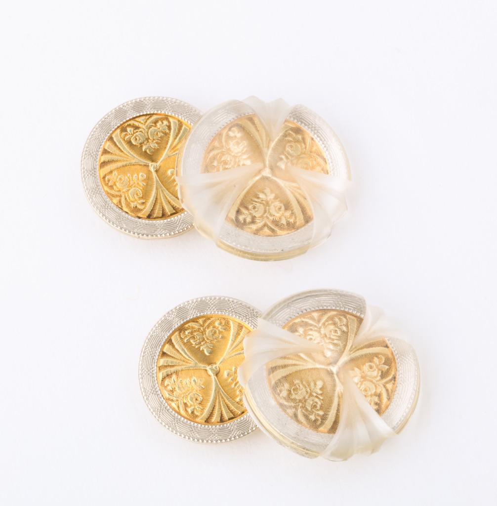 This one of a kind pair of cufflinks is the perfect combination of old and new.  The circa 1940 yellow and white gold discs are beautifully engraved and representative of the period.  Rock crystal cabochons are then hand carved by a fine, German