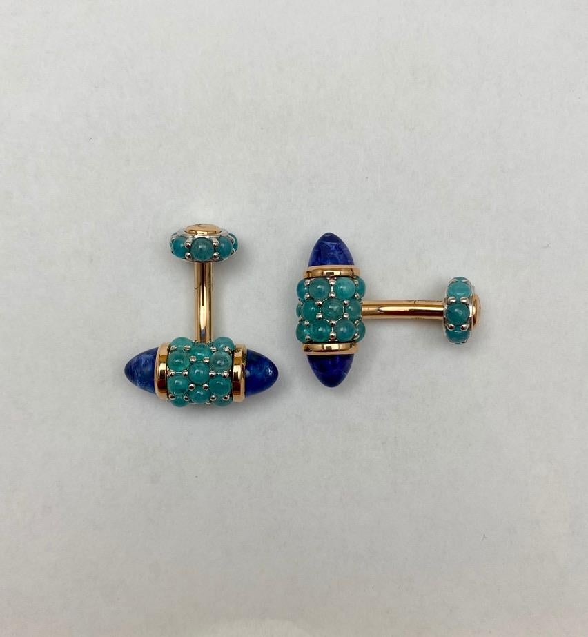 For the connoisseur who appreciates only the finest, and most unique, cufflinks.  Rare Brazilian Paraiba tourmalines are paired with custom cut bullet shaped tanzanites in a one of a kind rose gold mounting.   You will never see another pair like