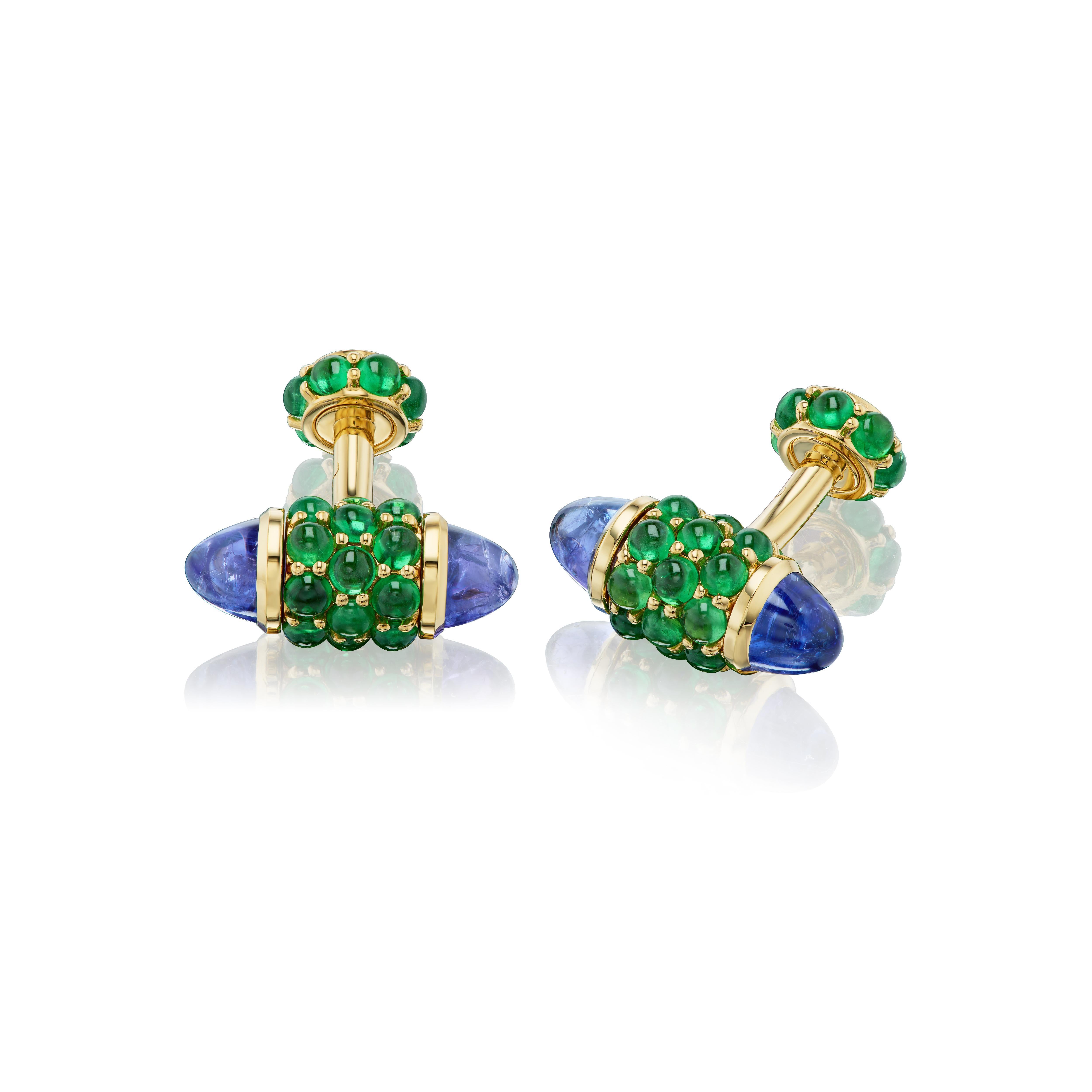 For the connoisseur who appreciates only the finest, and most unique, cufflinks.  Vivid green tsavorite garnets are paired with custom cut bullet shaped tanzanites in a one of a kind yellow gold mounting.   You will never see another pair like this