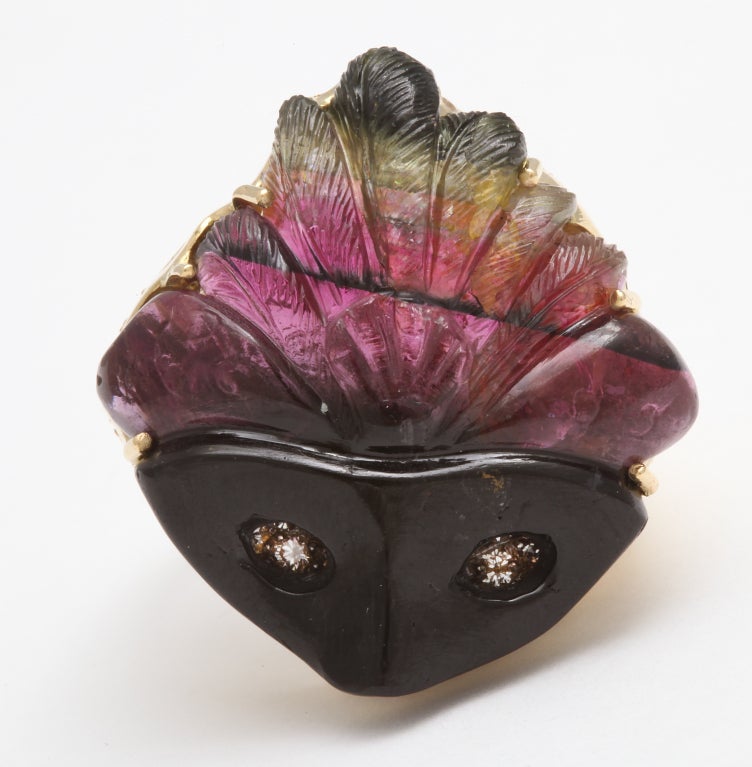 The beauty of this ring starts with an incredibly unique stone. Watermelon tourmaline naturally forms in a crystal with a black center and the red to green colors radiating to the outer edge.  With such a complex stone in hand only the most highly