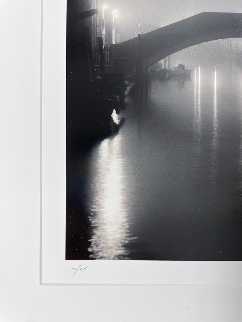 Ponte Fondamenta Bonini, Venice, Italy - River, Bridge, Canal, Night, Reflection - Black Landscape Photograph by Michael Kenna
