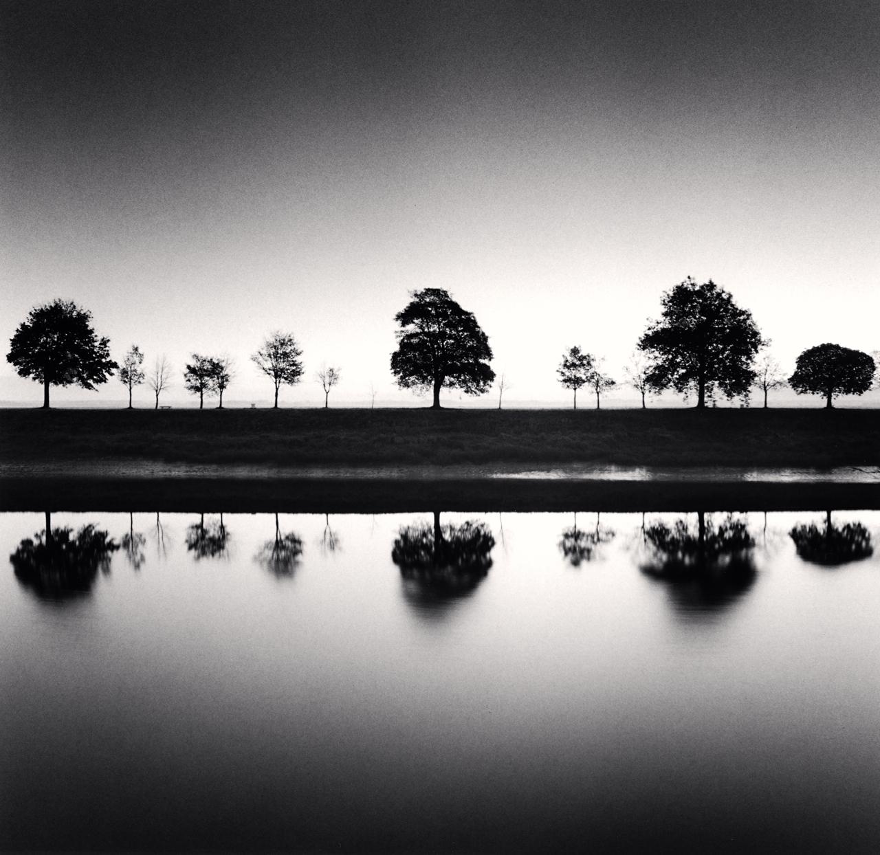 Michael Kenna Landscape Photograph - Reflecting Trees, Saint Valery sur Somme, France