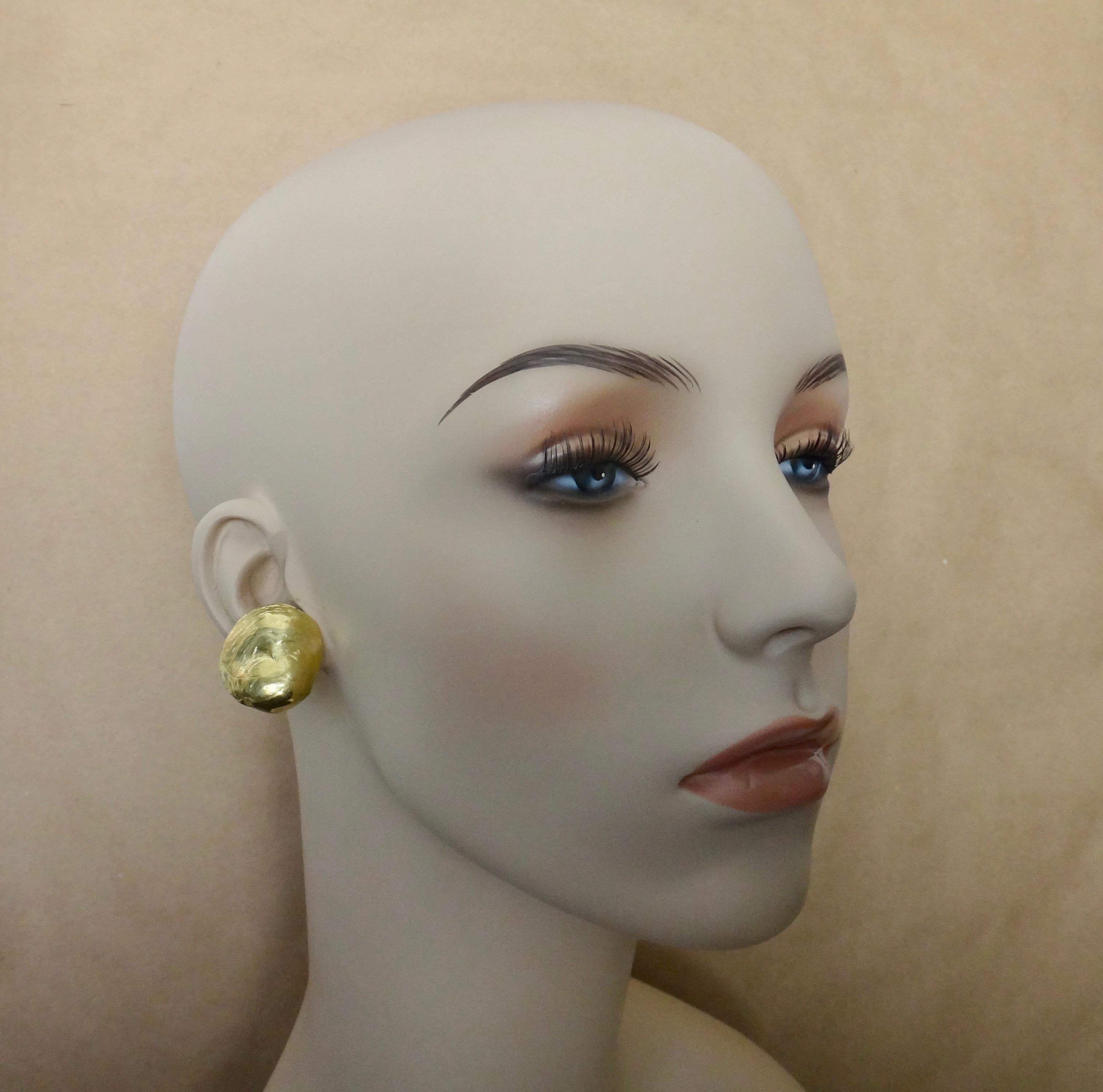 Offered are these Jingle shell earrings in 18k yellow gold.  