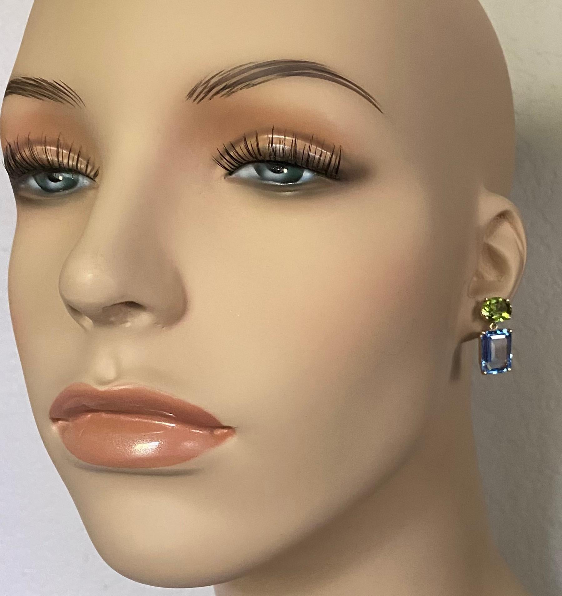 Mixed gemstones of amethyst and citrine along with blue topaz and peridot are combined to create these whimsical earrings. The complimentary color combinations are classics in the history of jewelry presentation.  These mis-matched earrings push
