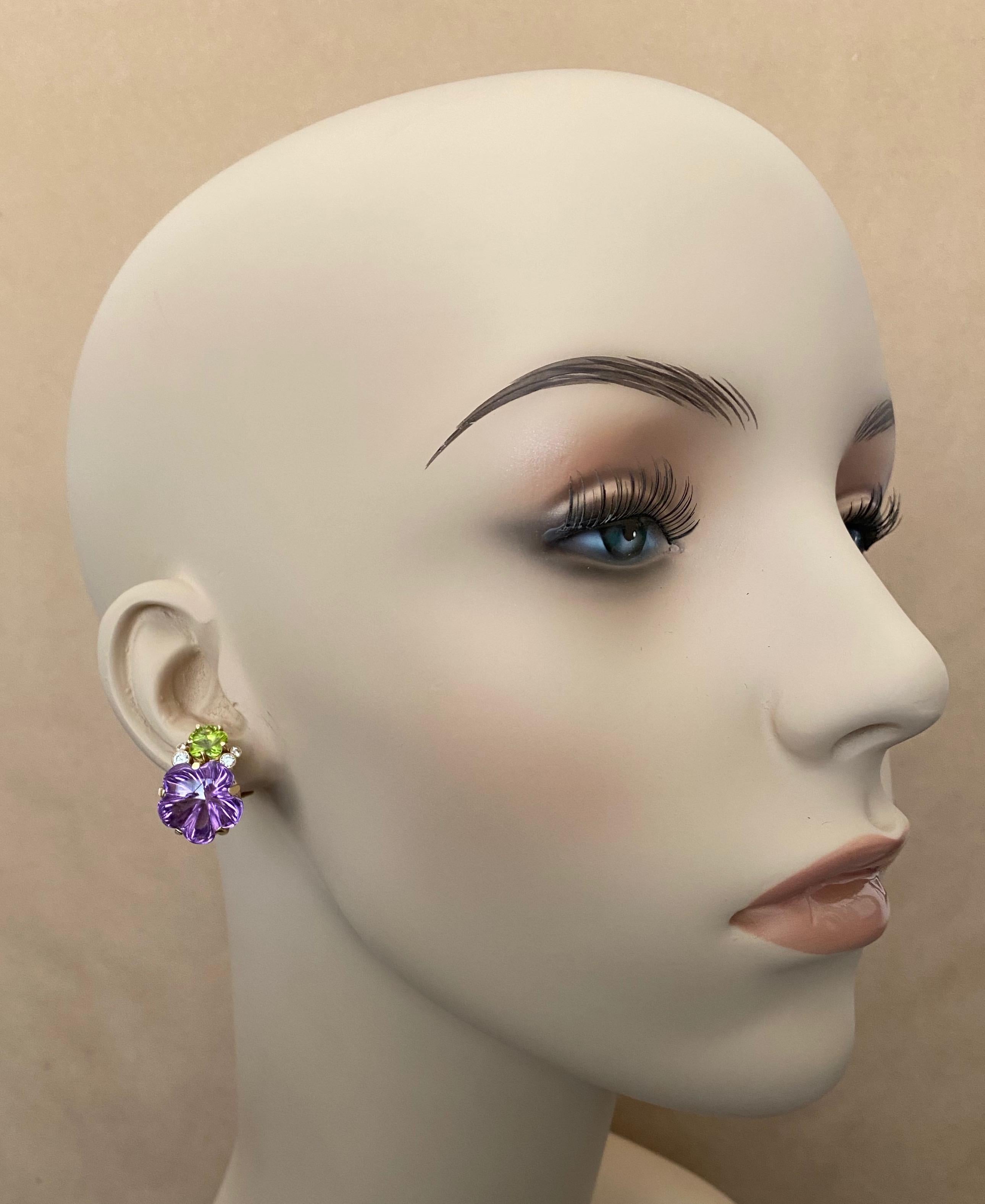 Amethyst and peridot gems (origins: Brazil) are carved into five petal flowers and featured in these one-of-a-kind button earrings.  Purple and lime green make a dynamic color combination  The gems are brilliant in color, exceptionally carved and