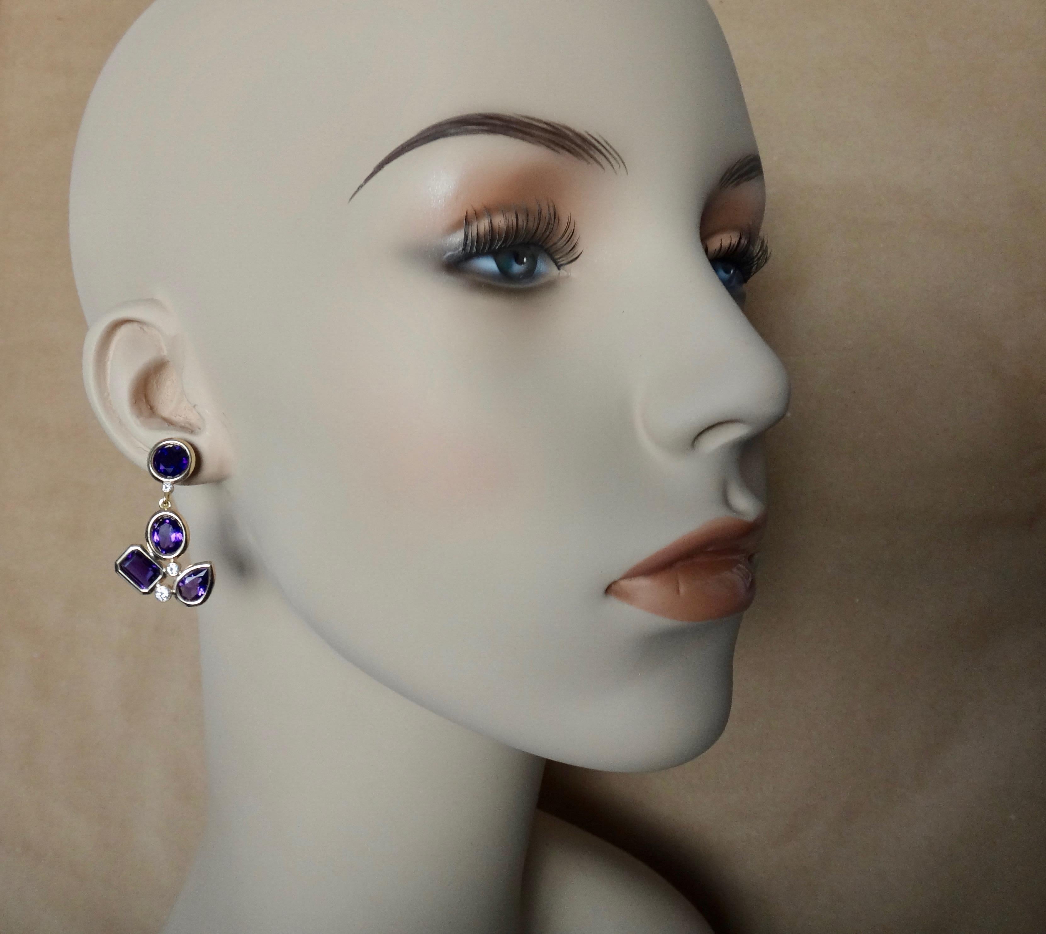 Various shapes of African amethyst form these whimsical Confetti dangle earrings.  They are of rich purple color and very well cut.  Spaced between the bezel set gems are tube set white diamonds.  These one-of-a-kind earrings have posts with very