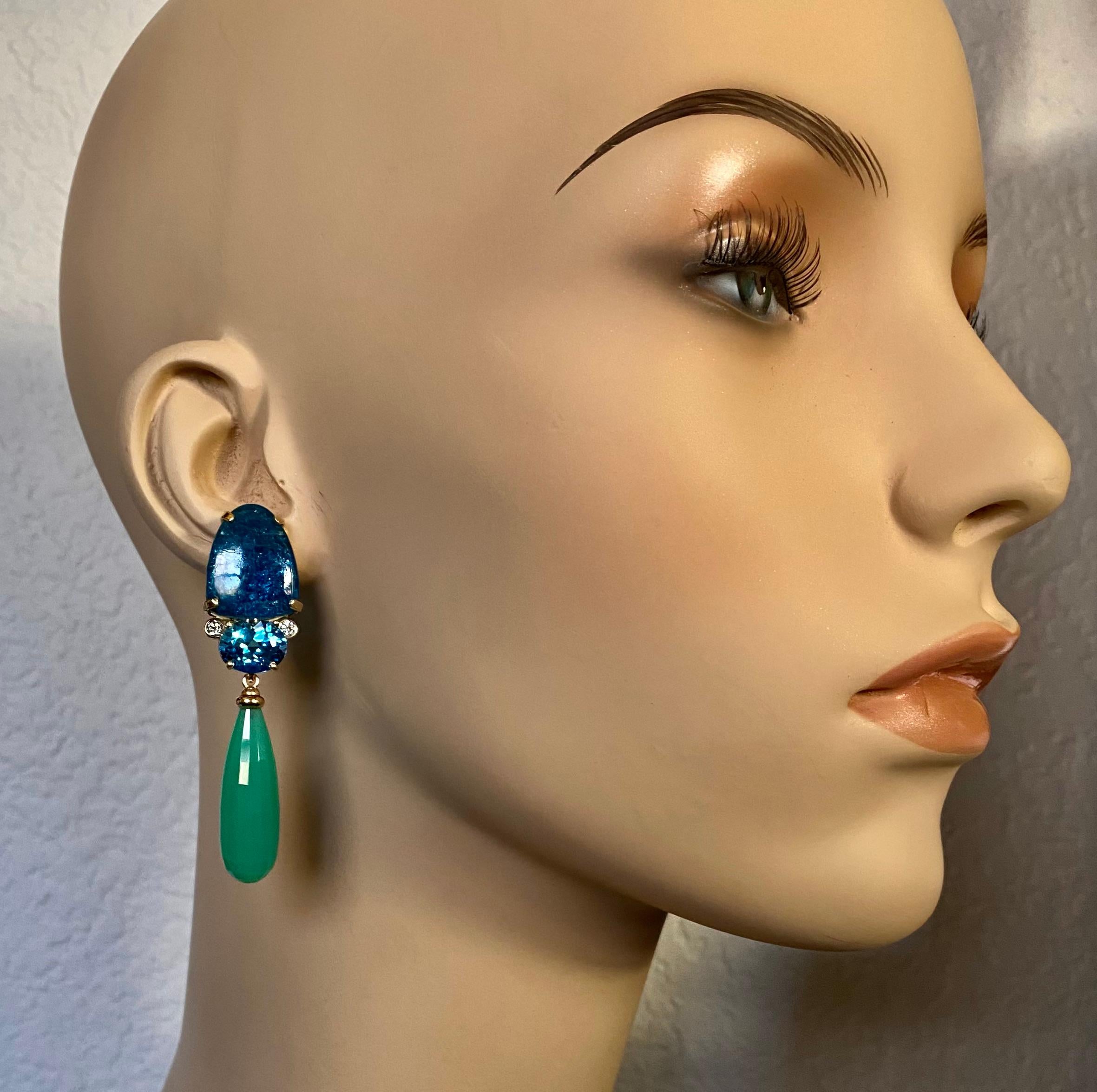 An elegant palette of cool blues and green combine in these sophisticated dangle earrings.  The apatite origin: Madagascar) is a royal blue color and possesses amazing chatoyancy.  Bringing out the lighter tones of the apatite are oval cut blue