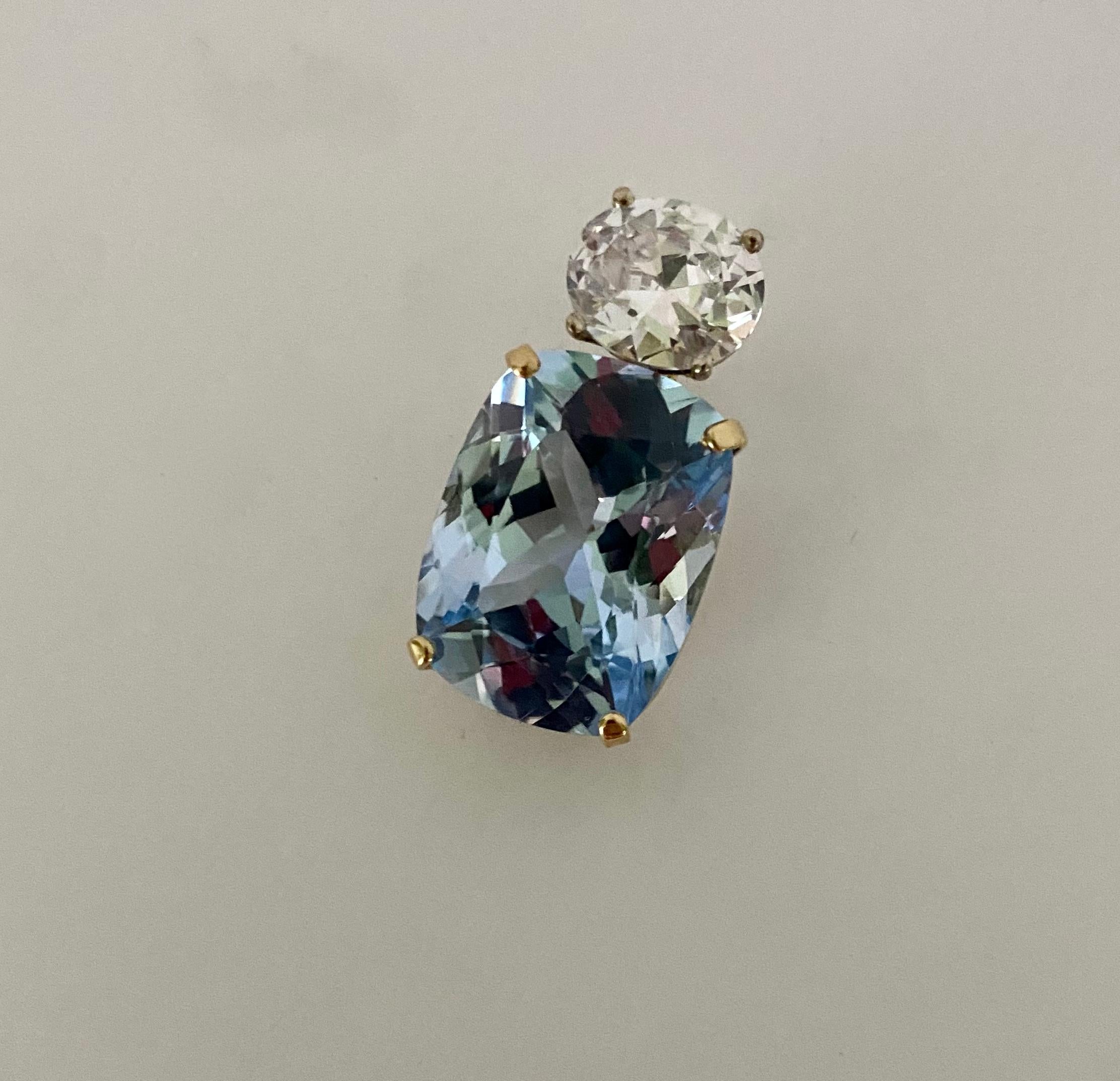 Aquamarine is paired with silver sapphire in this bold Due Gemme enhancer pendant.  The 28.93 carat, cushion shaped aquamarine (origin: Brazil) is a beautiful blue with no green undertones and is exceptionally well  faceted.  The white sapphire