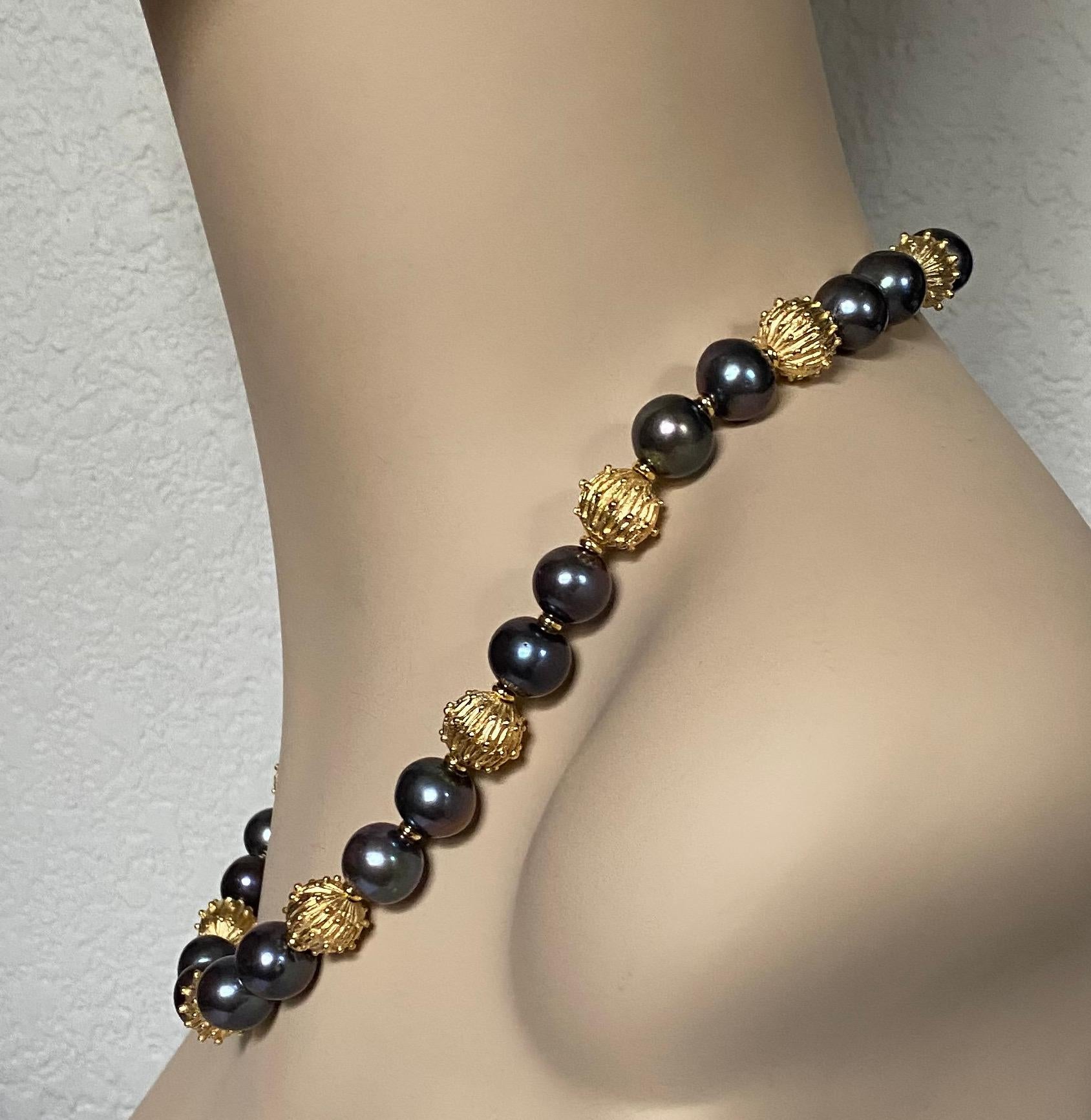 Baroque black pearls are paired with granulated beads in this bold beaded necklace.   The pearls (origin: China) are referred to as 