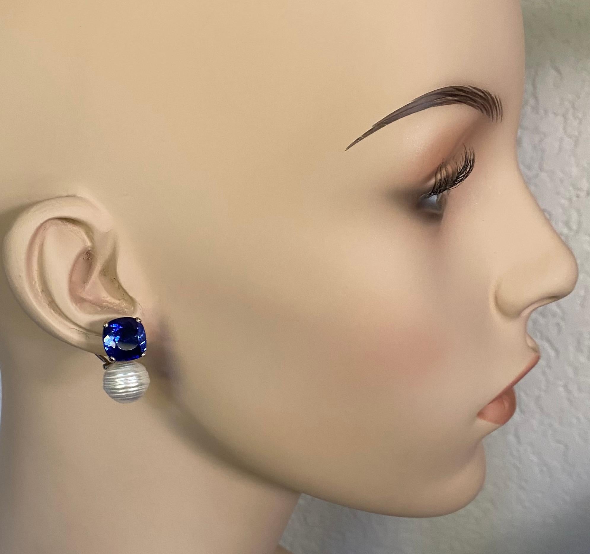 Blue sapphires are paired with Paspaley South Seas circle' pearls in these Due Gemme drop earrings.  The sapphires (origin: Thailand) are a rich, velvety blue, cushion shaped and are very well cut and polished.  The sapphires are complimented by 12