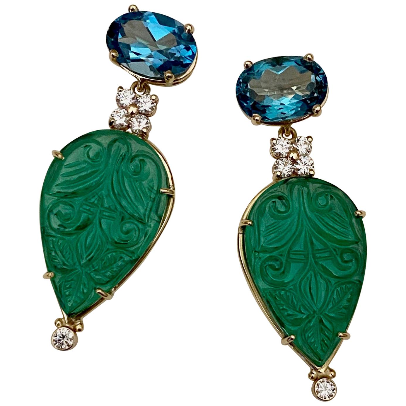 A cool palette of green and blue are showcased in these daring dangle earrings.  Oval cut blue topaz (origin: Brazil) are set horizontally.  They are well cut and very lively.  They compliment the green quartz (origin: Brazil) beautifully.  The