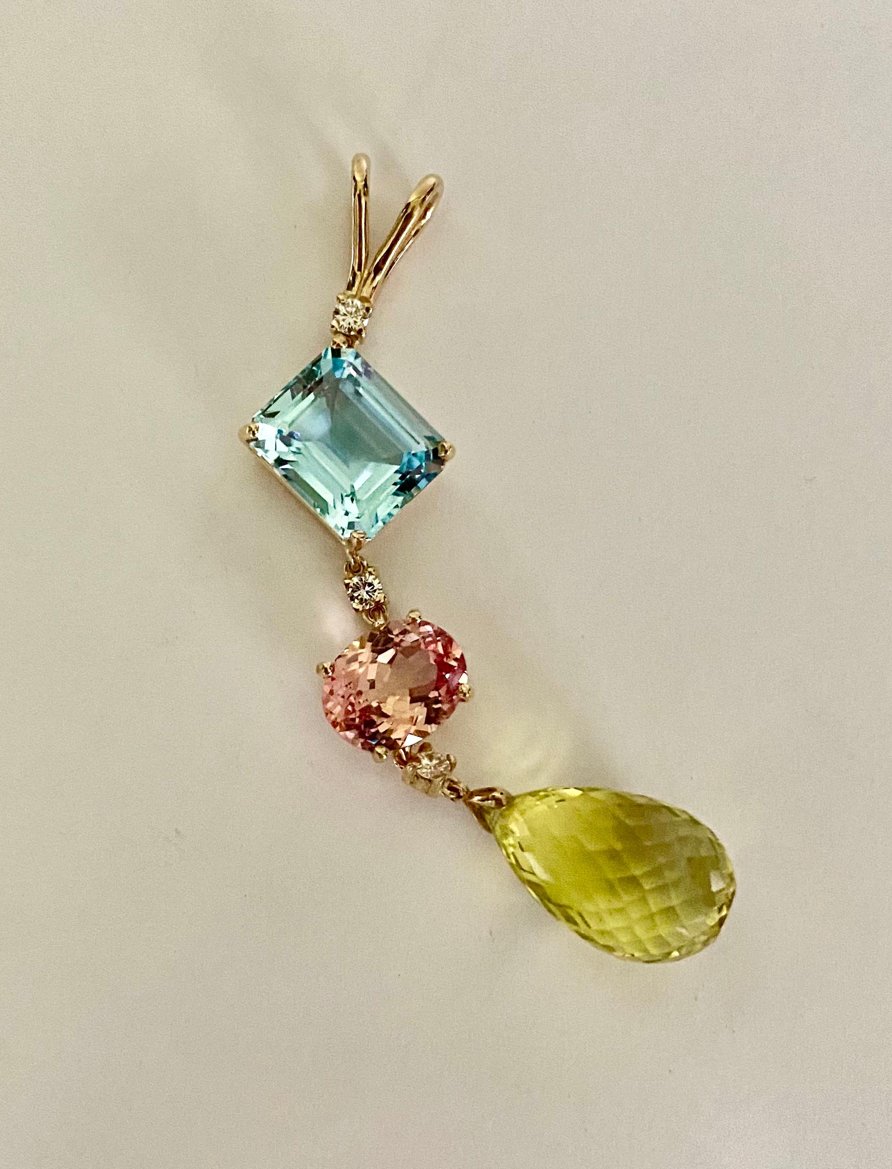 A medley of colors and shapes come together to create this elegant Stiletto pendant.  A sky blue topaz in an emerald cut tops the list.  Next, an oval pink topaz drops below.  White diamonds space the gems and add additional sparkle.  Finally, a