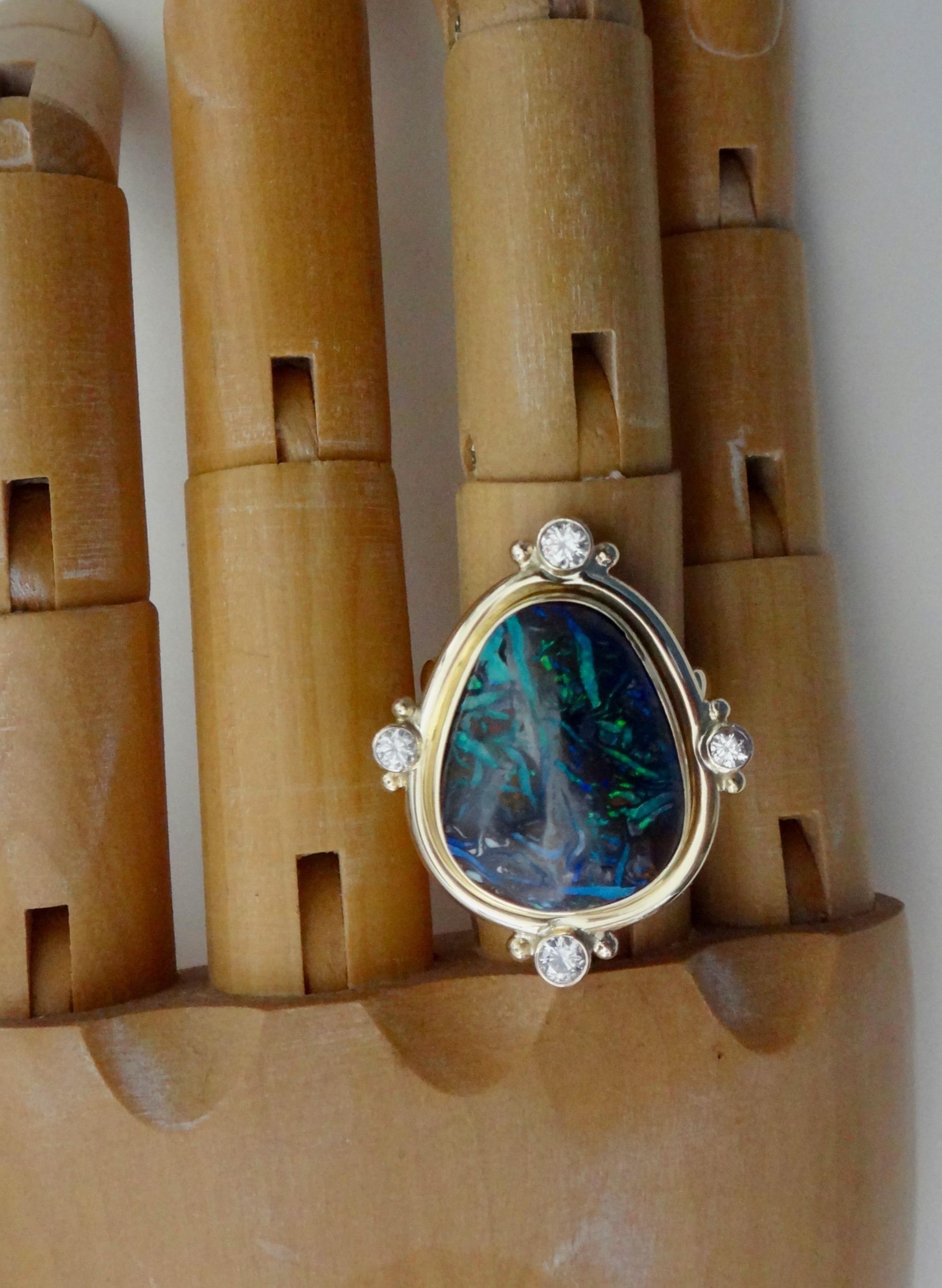 Boulder Opal (origin: Queensland, Australia) of a free-form shape is featured in this one-of-a-kind cocktail ring.  