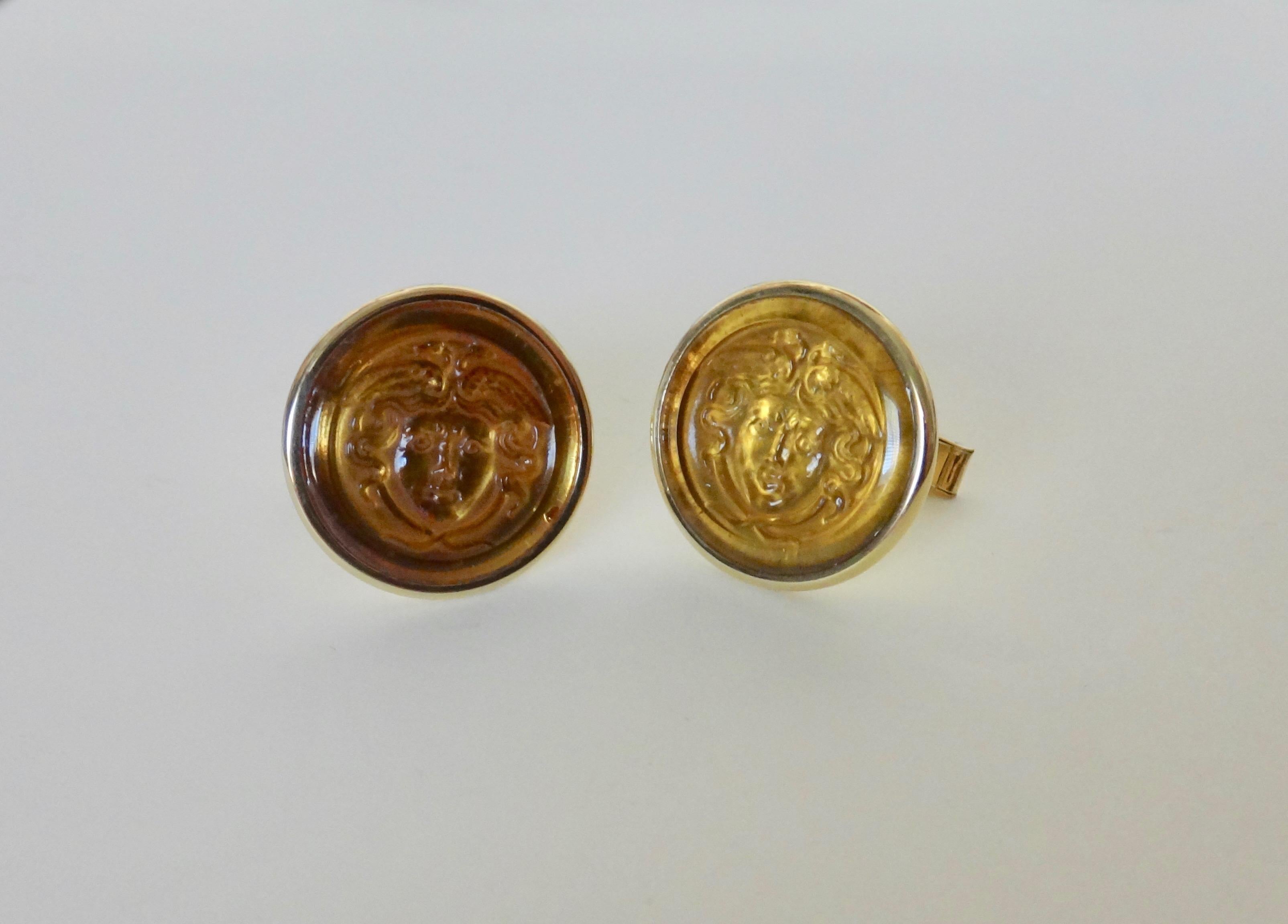 Carved in Germany, a classically sculpted pair of citrine Medusa head cameos are featured in these one-of-a-kind 18k yellow gold cuff links.  Sleek and time-honored, the pair are the perfect gift for the discriminating gentleman.  