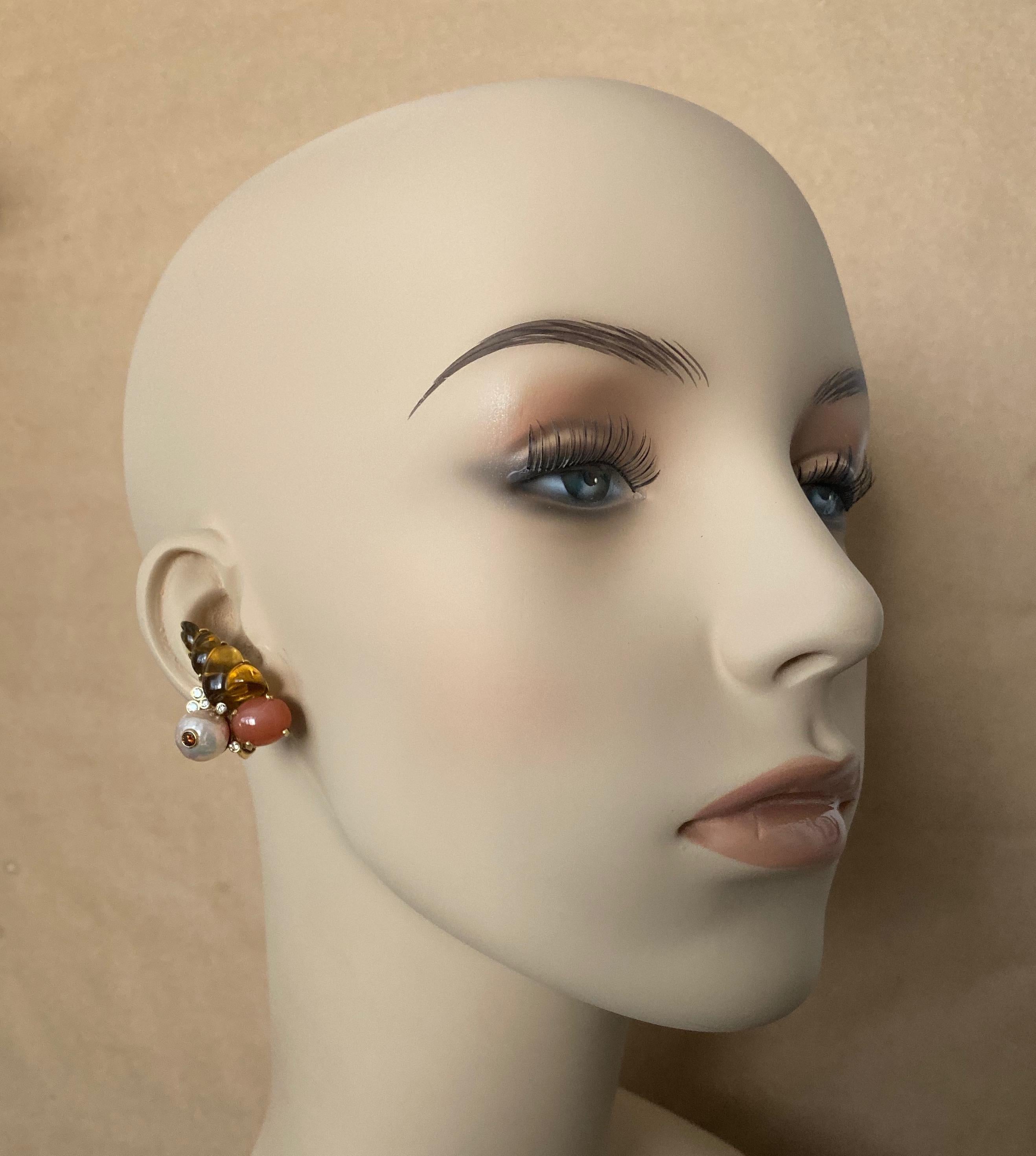 Carved in the form of shells, richly colored citrines are combined with orange moonstones and pink Kasumi pearls (origin: Lake Ksumi, Japan) to form these sensational cluster earrings.  The citrines were expertly carved in Idar-Oberstein, Germany,