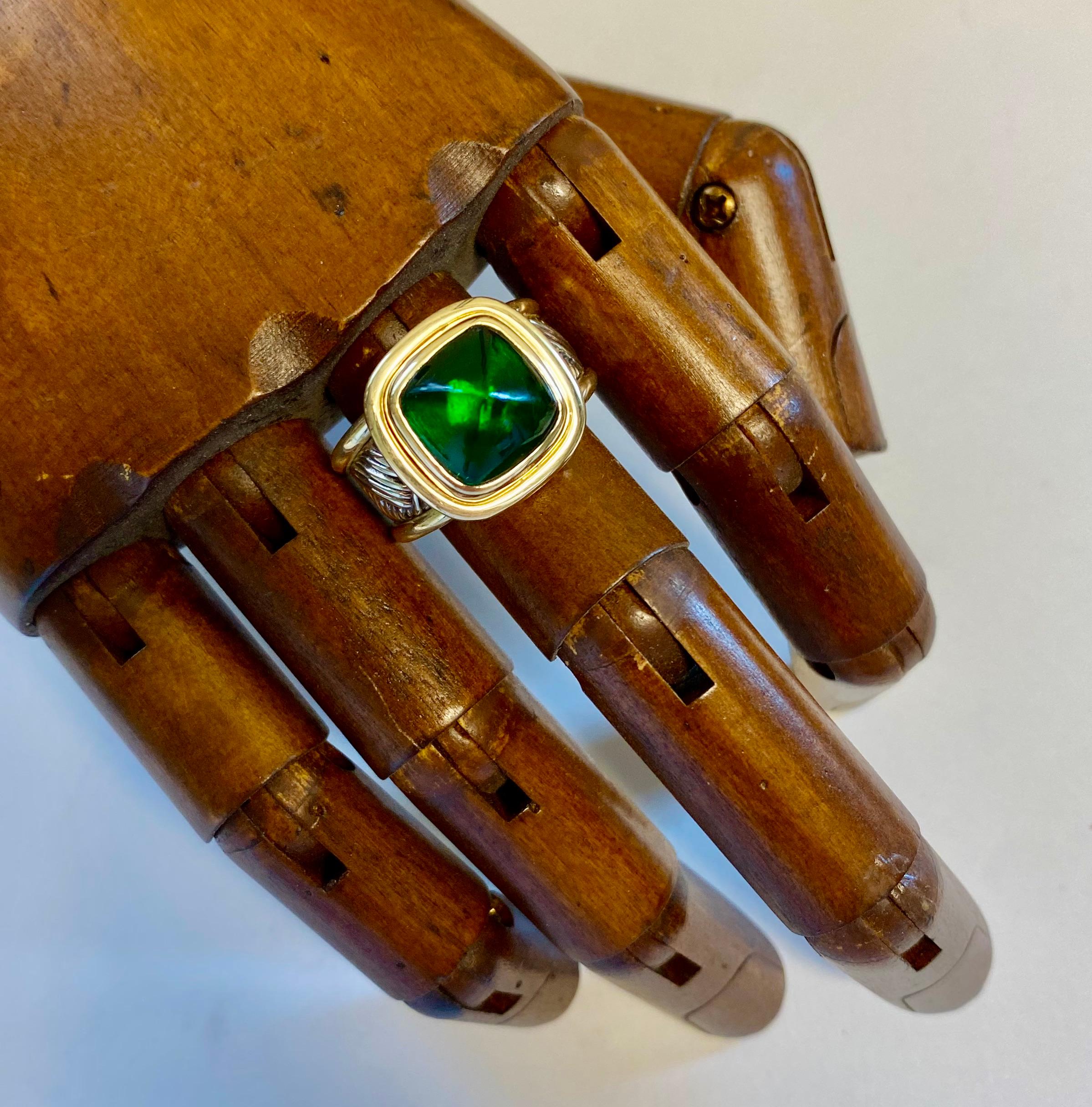 Chrome tourmaline is featured in this one-of-a-kind bombe style ring.  The tourmaline (origin: Brazil) is a rich, true green color.  It's been cut in a very desirable and unusual sugarloaf cabochon shape.  The gem is set in a one-of-a-kind