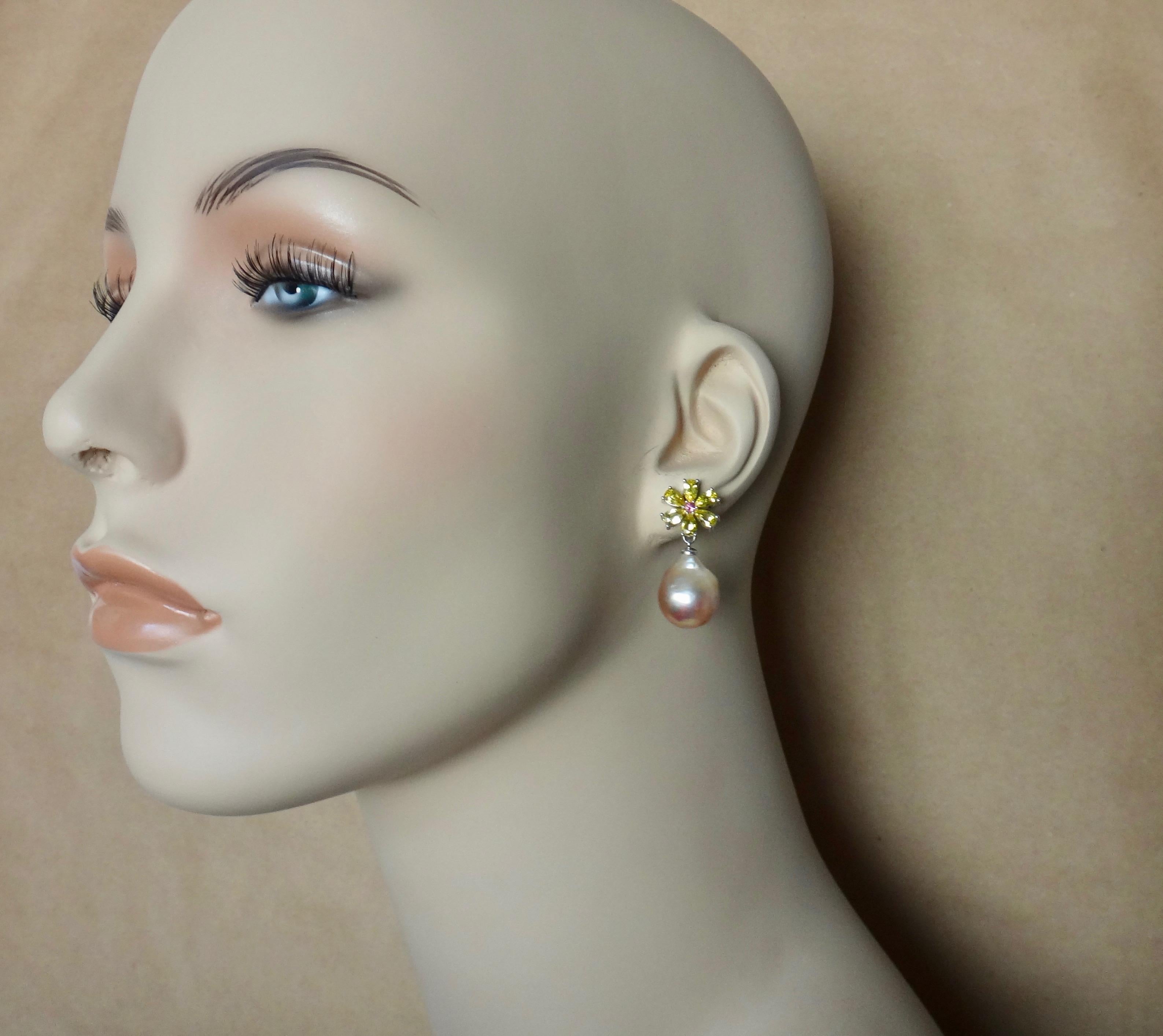 Pear shaped citrine are paired with baroque Kasumi pearls (origin: Japan) in these dainty dangle flower earrings.  The six citrines are a lively lemon yellow and surround bright pink tourmalines.  The colored gems play off the pink pearls with