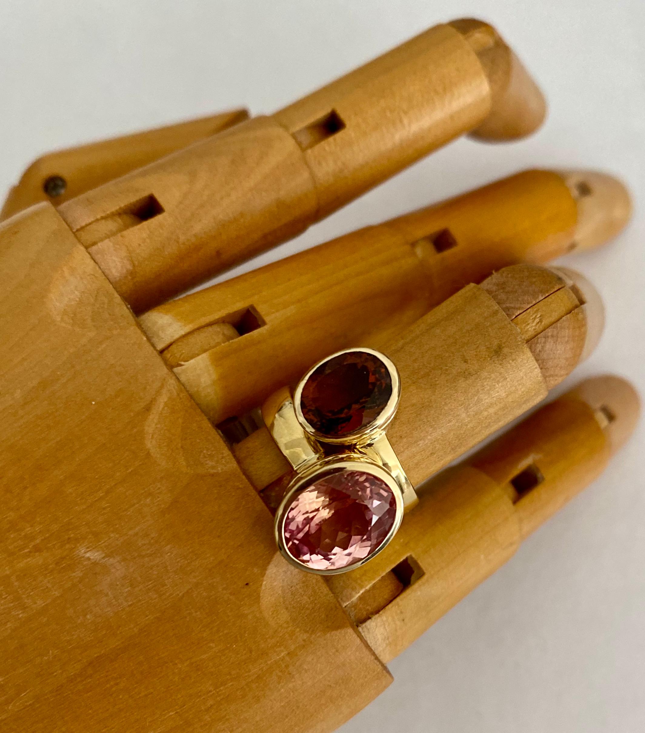 Cognac tourmaline (also known as dravite tourmaline) is paired with Morganite in this sensational pairing of Leah rings.  The gems are exceptionally well cut and polished.  They are bezel set in 18k yellow gold mounts with beaded detail.  Please see