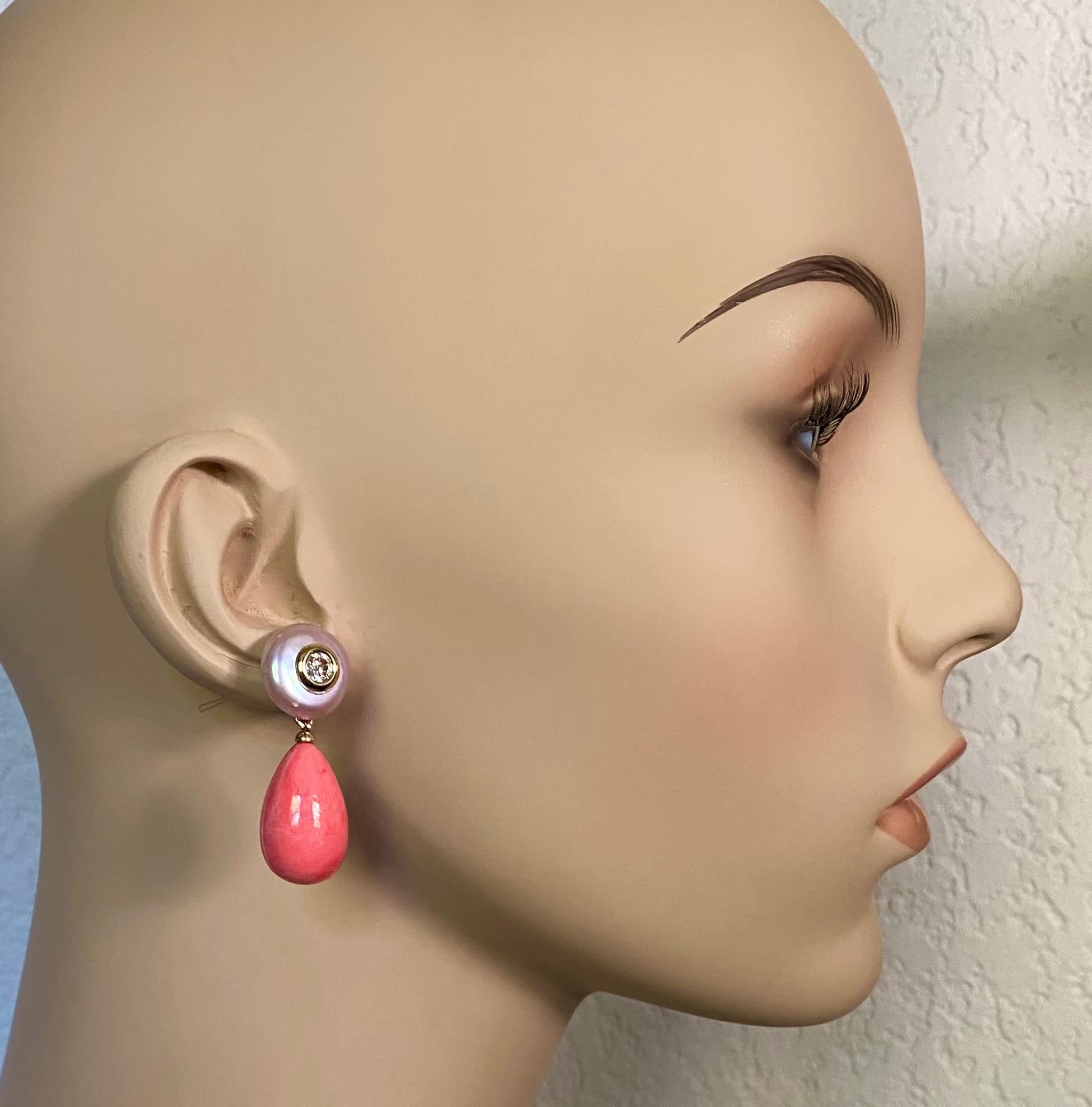 Coin pearls are paired with queen conch shell drops in these sophisticated dangle earrings.  The coin pearls (origin: China) are considered baroque because of their flattened and irregular round shape.  They are a very light silver gray and possess
