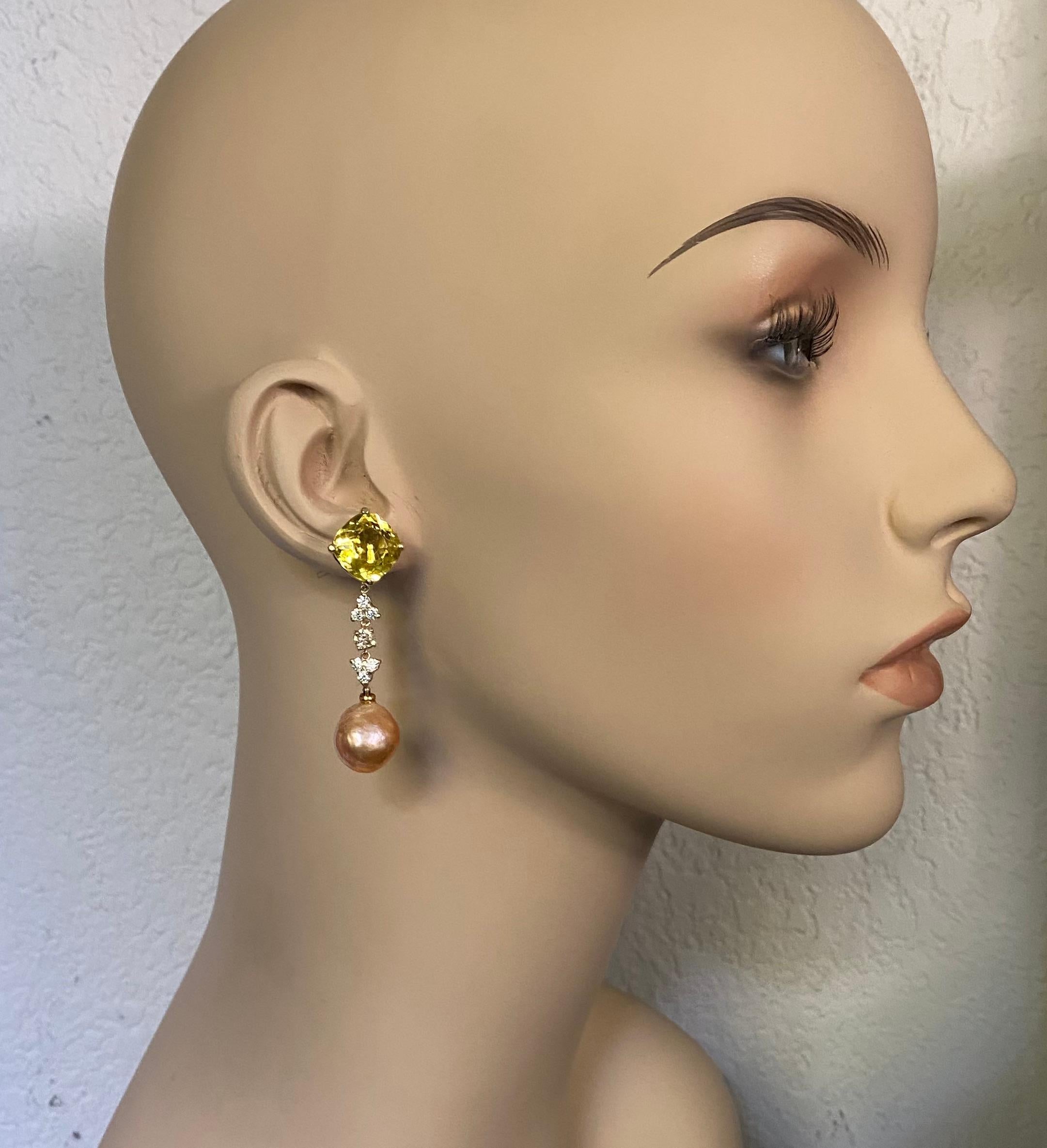 Golden beryl is paired with Kasumi pearls in these elegant dangle earrings.  Golden beryl (origin: Brazil) is a member of the larger beryl family which includes aquamarine, emerald, Morganite, heliodor, bixbite and chrysoberyl.  This pair of gems