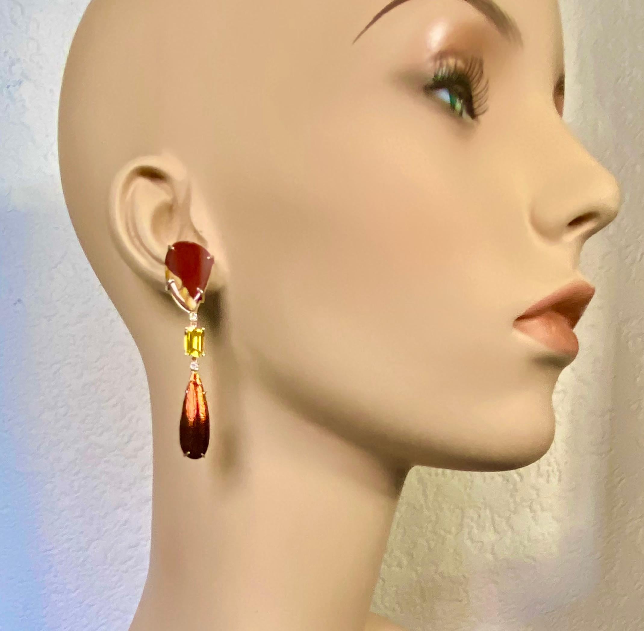 Jasper, golden beryl and scarab beetle wings are combined to form these one-of-a-kind dangle earrings.  The free-formed shape jaspers (origin: India) are in rust and gold colors.  They have been brightly polished.  The emerald cut golden beryls