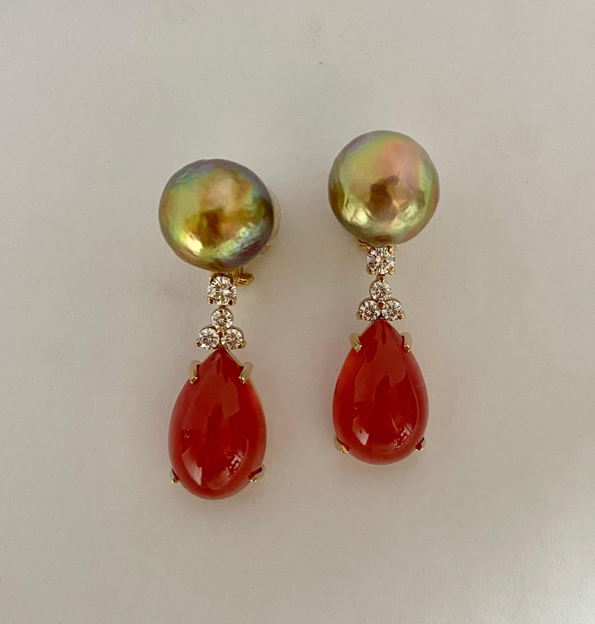 Gem quality rhodochrosite cabochons are featured in these arresting dangle earrings.  The gems (origin: Peru) are truly spectacular examples of the mineral.  It's almost impossible to describe the rich color-maybe strawberry jam?  The rhodochrosite