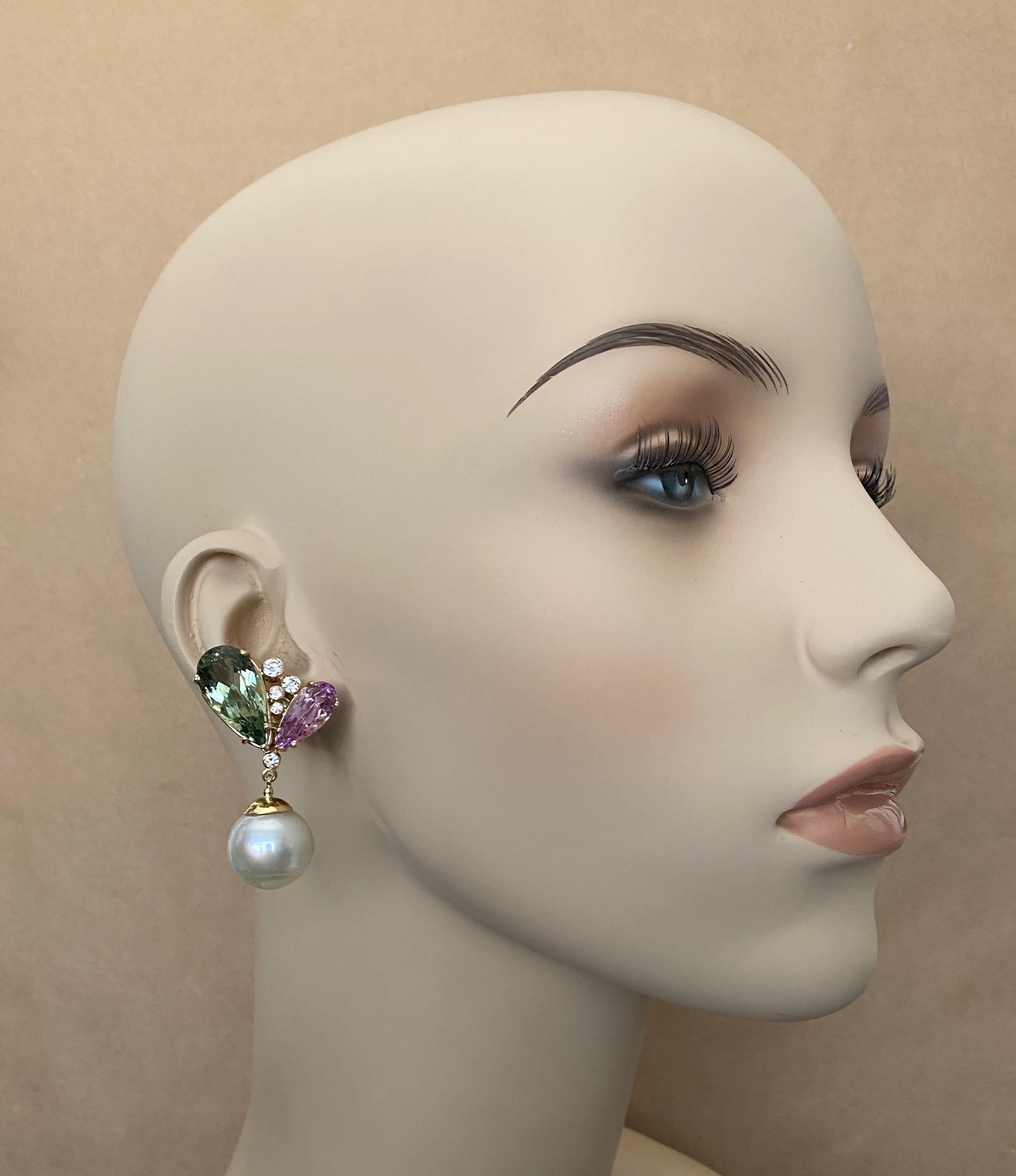 Pear shaped pink kunzite and green hiddenite (origins: Brazil) are paired in these impressive dangle earrings.  Kunzite and hiddenite are related gems, both members of the spodumene family.  All four gems are of optimum color and are very well cut