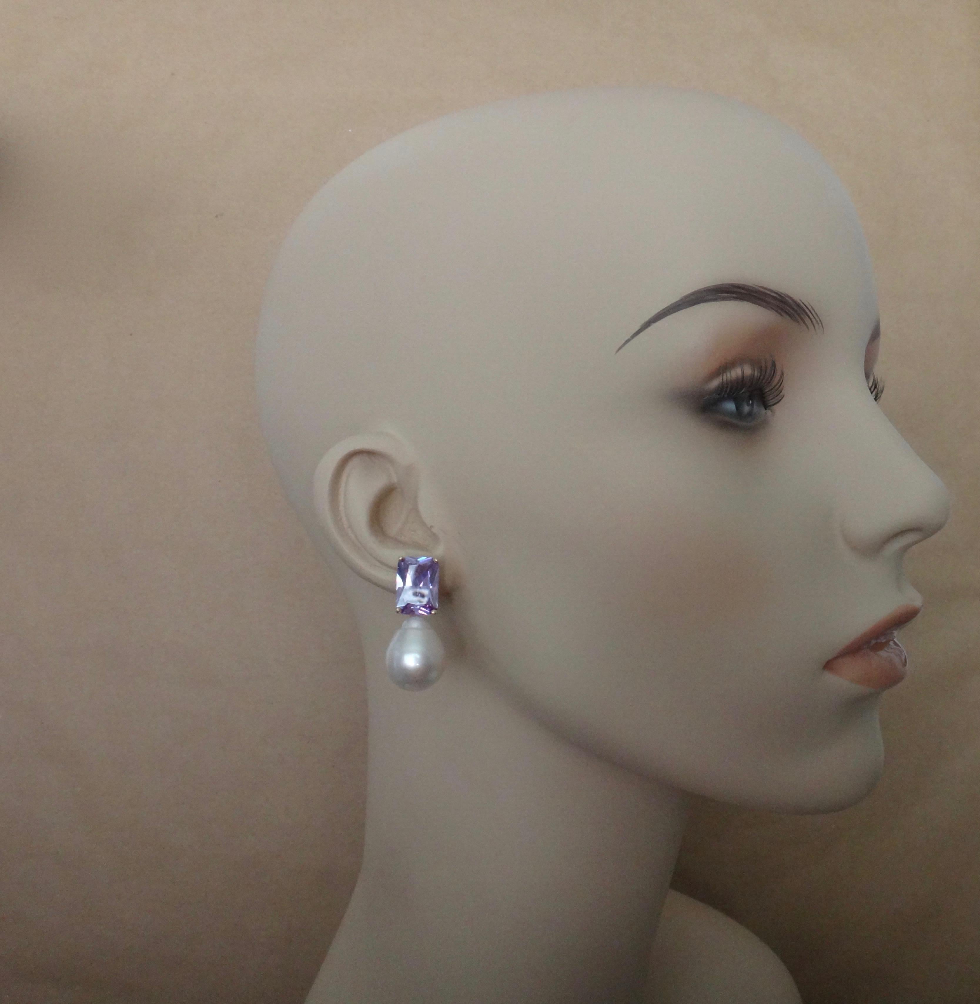 Lavender zircons (origin: Sri Lanka) are paired with Paspaley South Seas pearls (origin: Australia) in these sophisticated drop earrings.  (Zircon is a natural gemstone and is not to be confused with cubic zirconia.) The rectangular shaped zircons