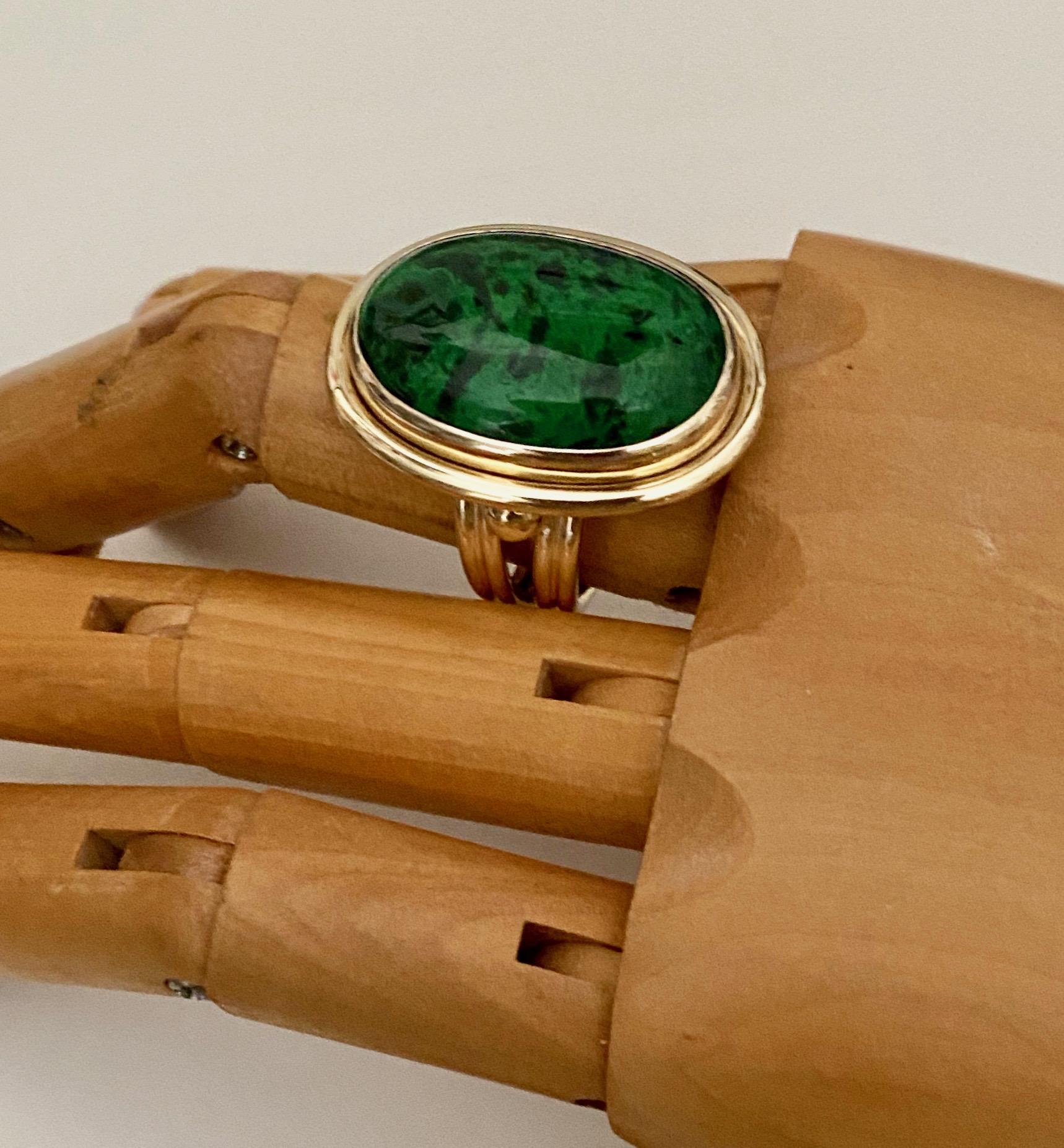 Maw Sit Sit jade is featured in an archaic style ring.  This type of jade was discovered in 1963 and is found exclusively in northern Myanmar.  It was named after the village close to where it was unearthed in the foothills of the Himalayas.  Maw