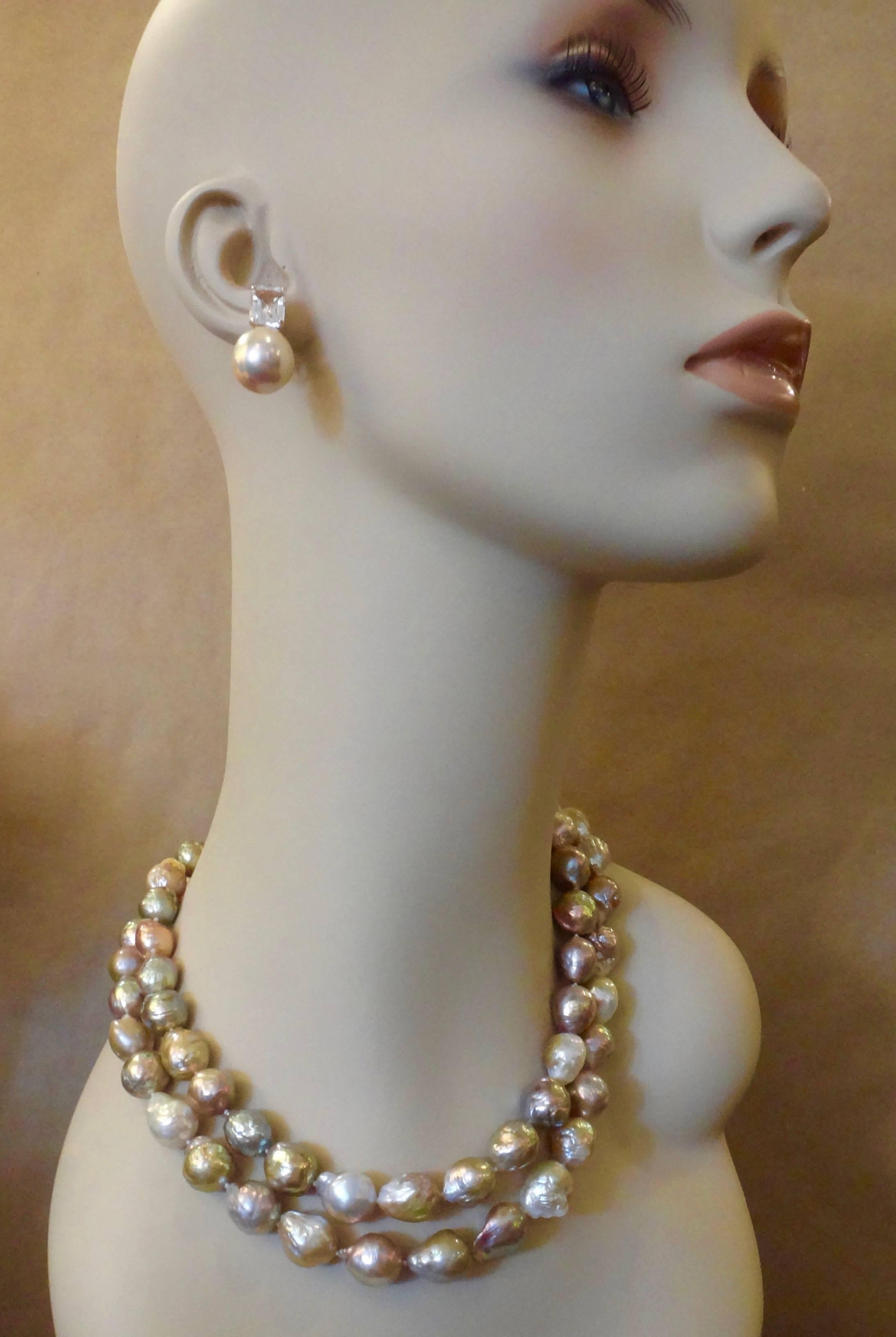 Two strands of Kasumi pearls (origin: Lake Kasumi, Japan) form this bold necklace.  Kasumi pearls are renowned for their metallic luster and rich baroque surfaces.  These multicolored strands run the full spectrum of colors including bronze, pink,