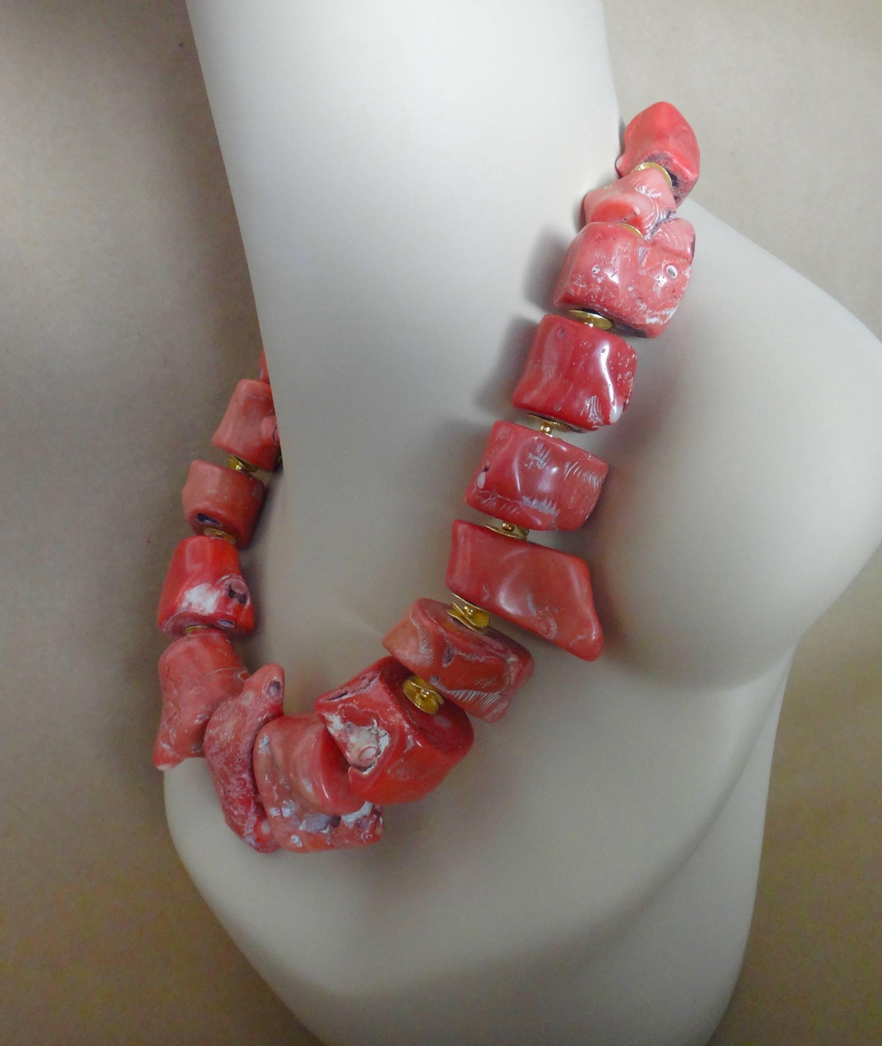 Nineteen monumental nuggets of natural branch coral form this colossal necklace.  The beads are spaced with potato chip shaped rondelles and round gold beads to add depth of interest and flexibility.  The necklace is 20 inches long-long enough to be