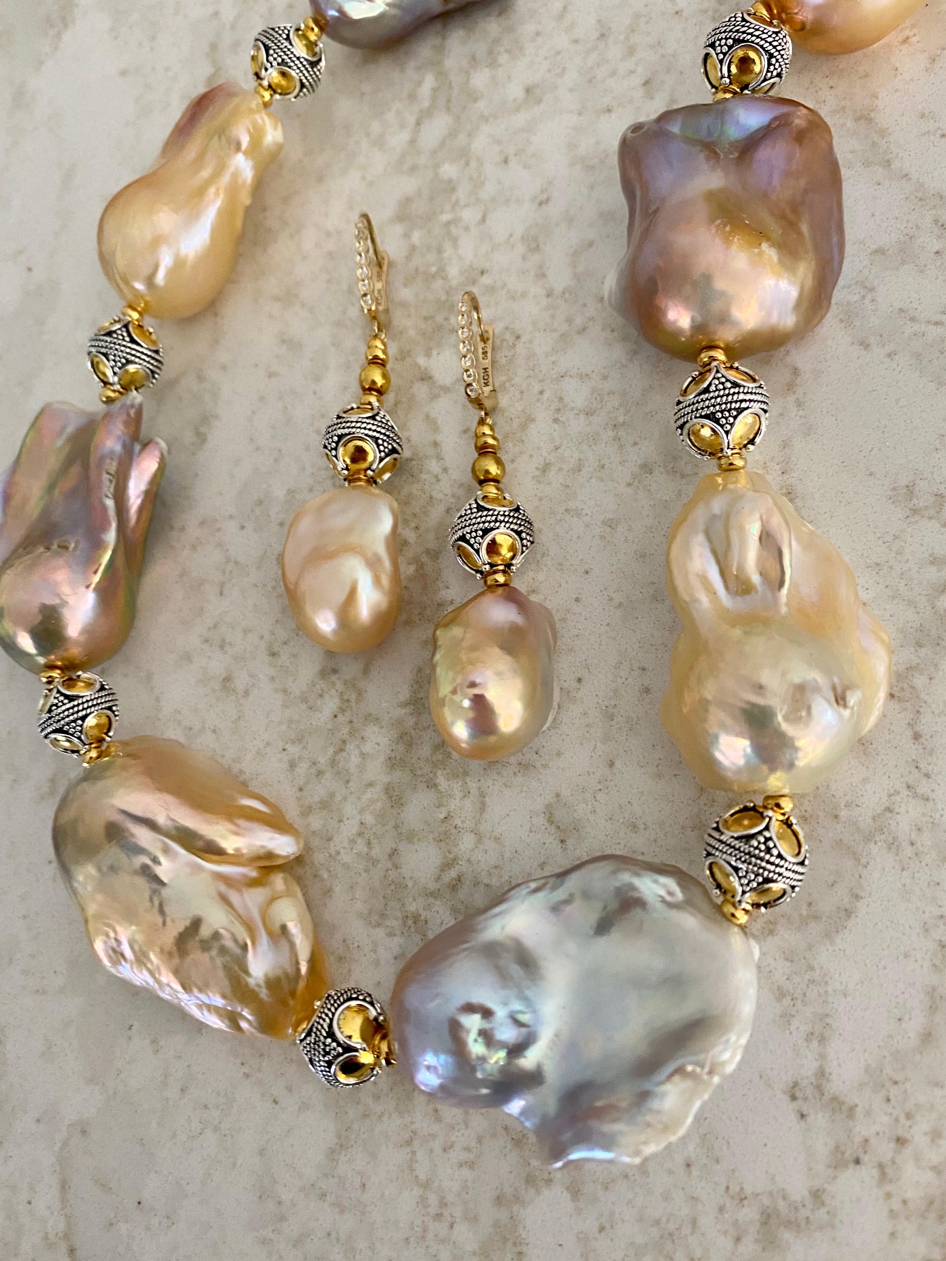 Baroque pearls (origin: China) are featured in this necklace and earring suite.  The pearls are in shades of pink, lavender, peach and gray.  They are blemish free and possess splendid luster.  The necklace measures 23 1/2 inches.  The earrings are