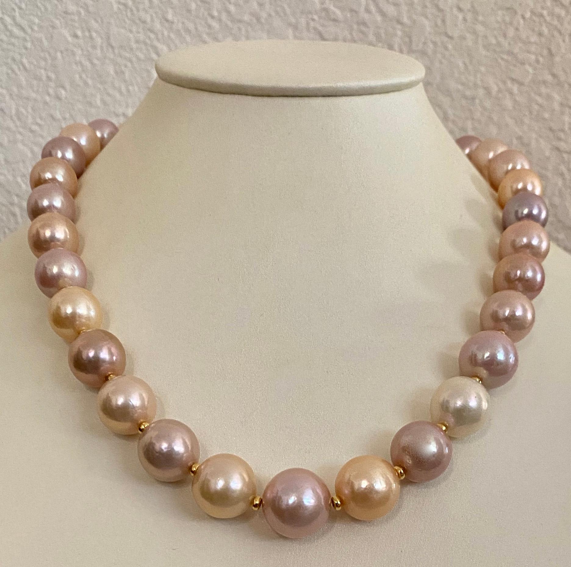 Freshwater pearls in shades of peach, lavender, cream and pink are mixed together to form this superb necklace.  The huge 32 pearls (origin: China) are slightly graduated in size from 1/2 inch to 5/8 inches.  They are blemish free and have rich