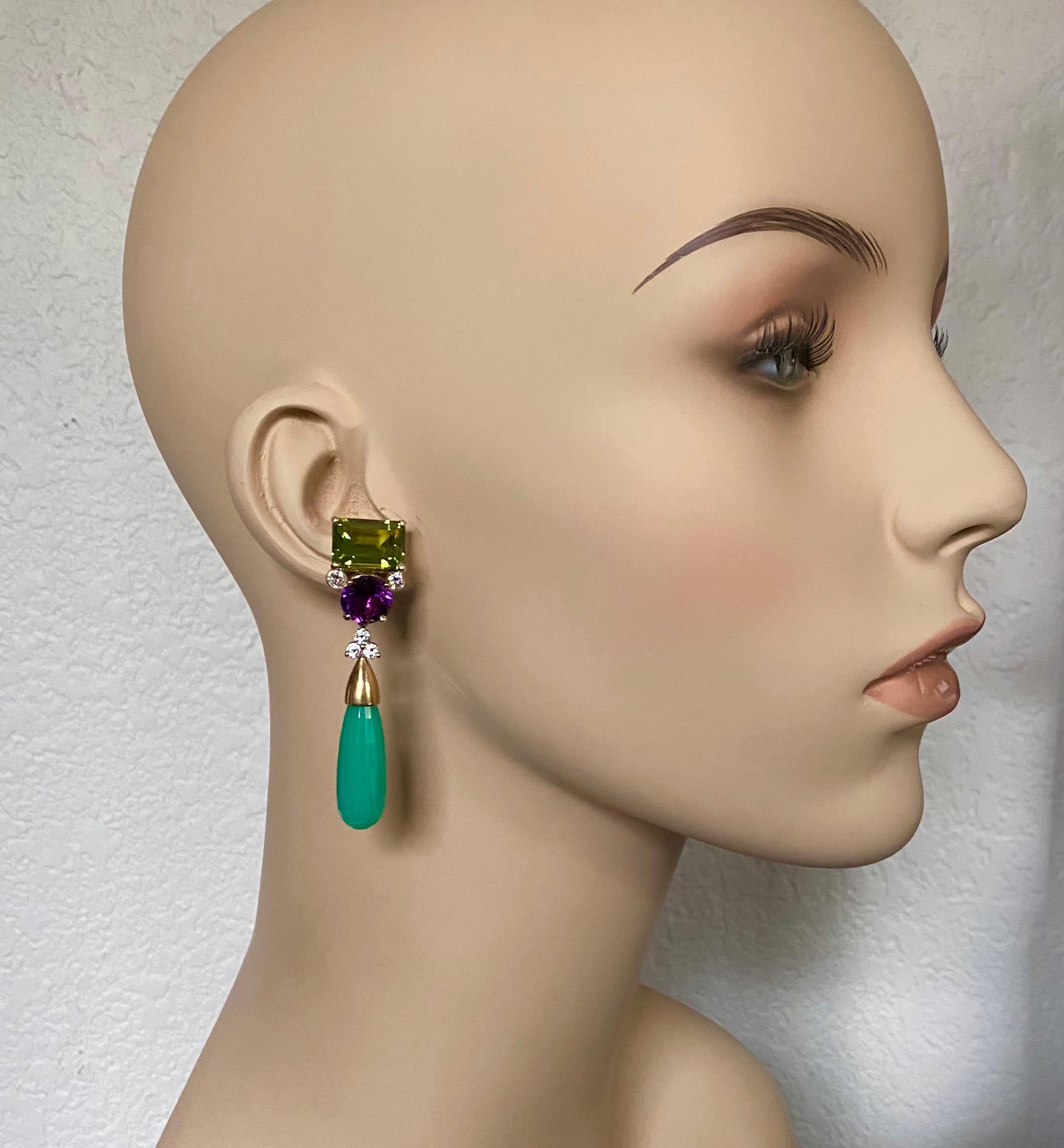 Peridot and amethyst are paired along with detachable chrysoprase drops in these dynamic dangle earrings.  The gem quality peridot (origin: Pakistan) are the classic yellow/green color and are a perfect foil to the richly colored amethyst (origin: