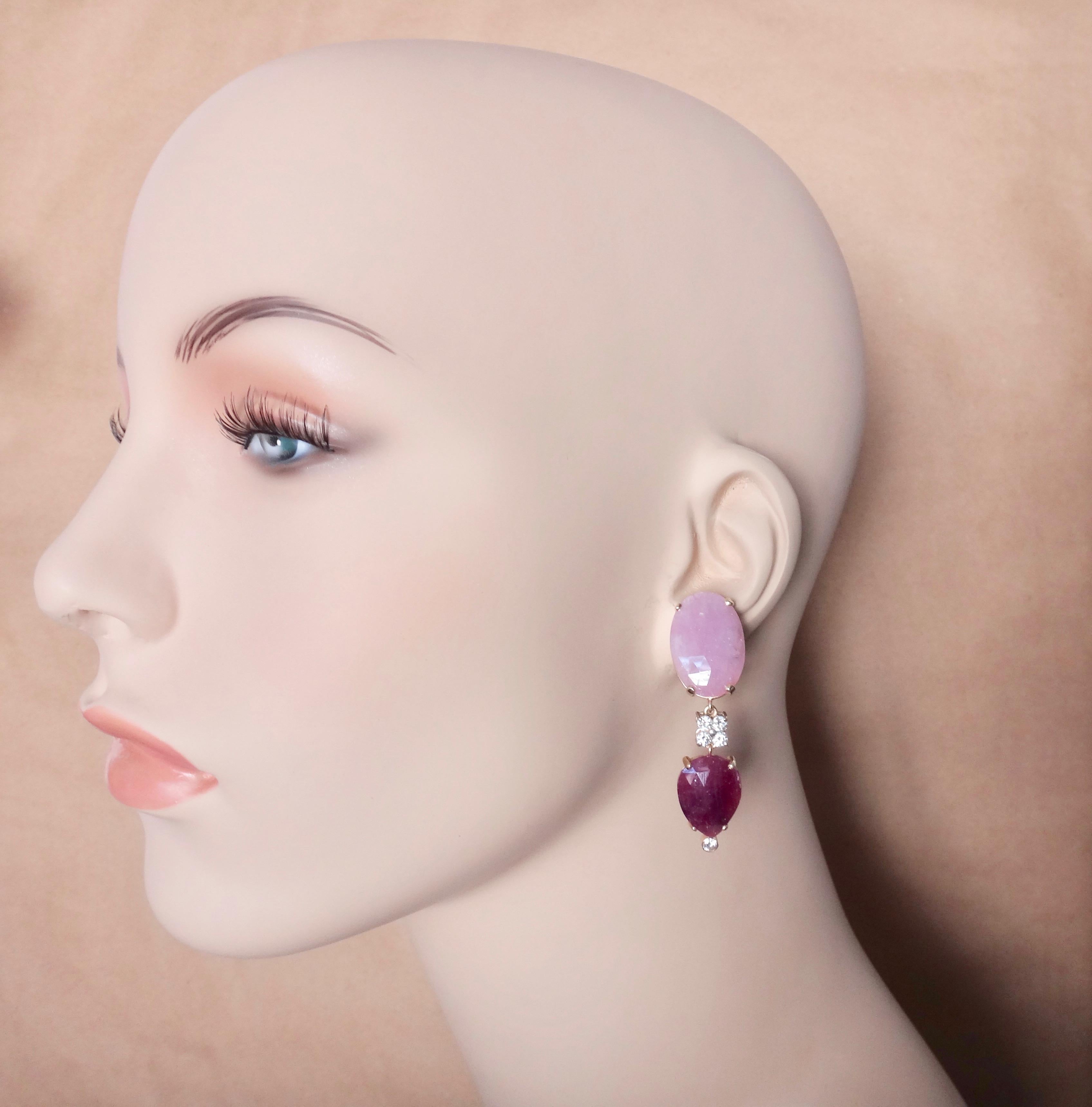 Checkerboard faceted slices of pink sapphire and ruby (Origins: Thailand) are paired in these striking dangle earrings.  The shell pink of the sapphires is a powerful compliment to the 