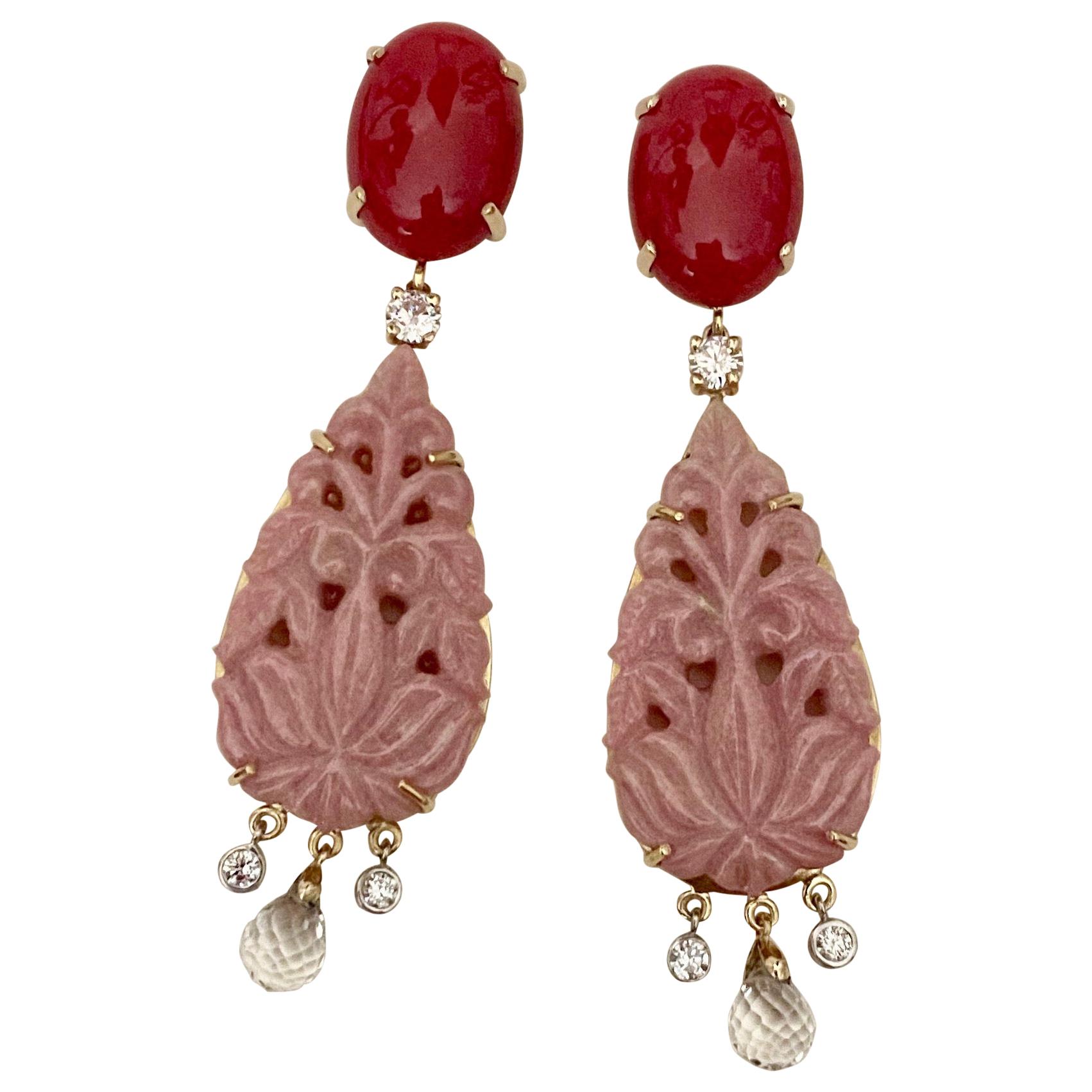Pink rosaline (origin: Norway) is complemented by red coral (origin: the Mediterranean Sea) in these exotic dangle earrings.  Rosaline is a crystalline, manganese-bearing variety of the mineral zoisite.  These perfectly matched drops are expertly